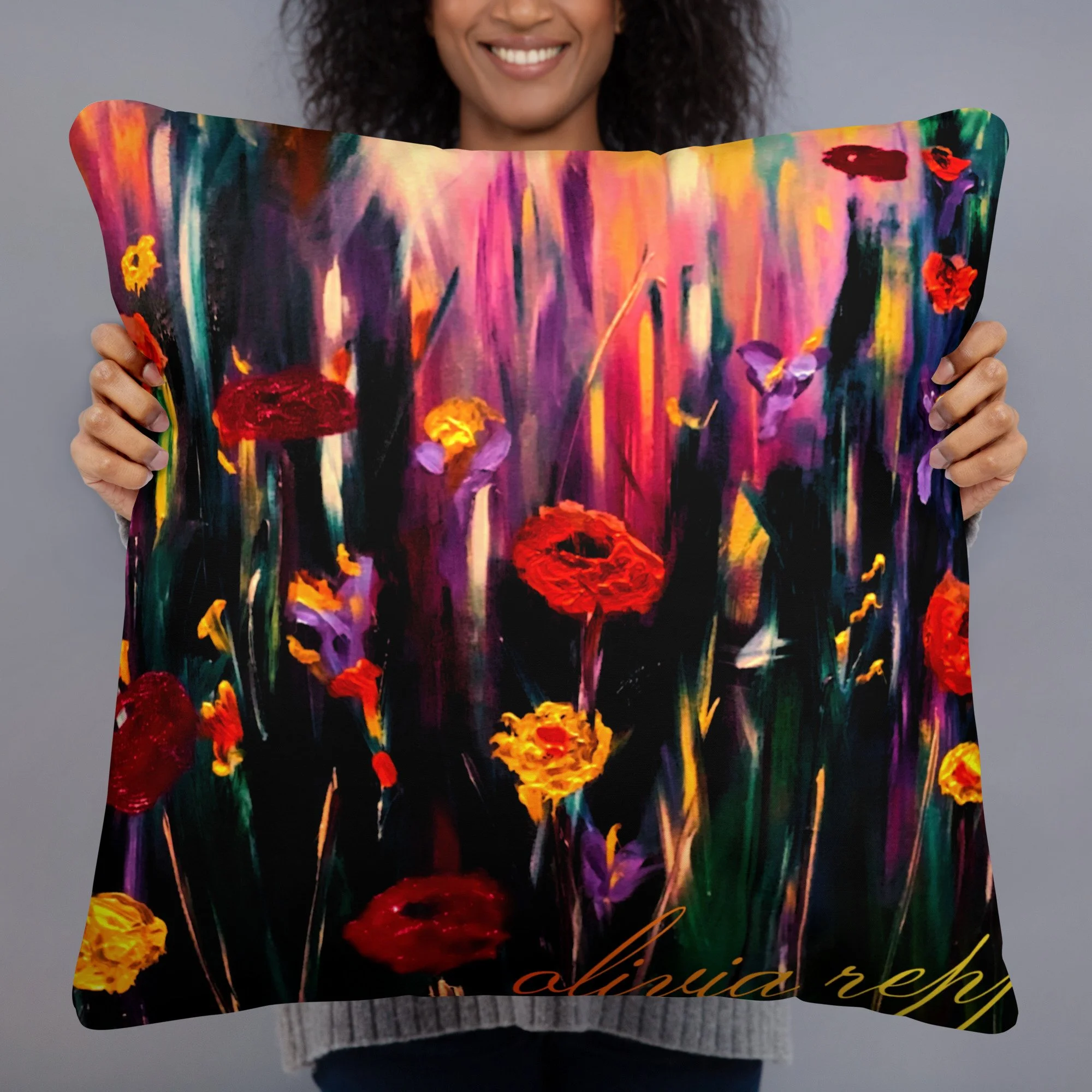 Woman holding a decorative cushion featuring vibrant poppy artwork with bold red and golden flowers, purple blooms and rich expressive colours on a dramatic botanical background.