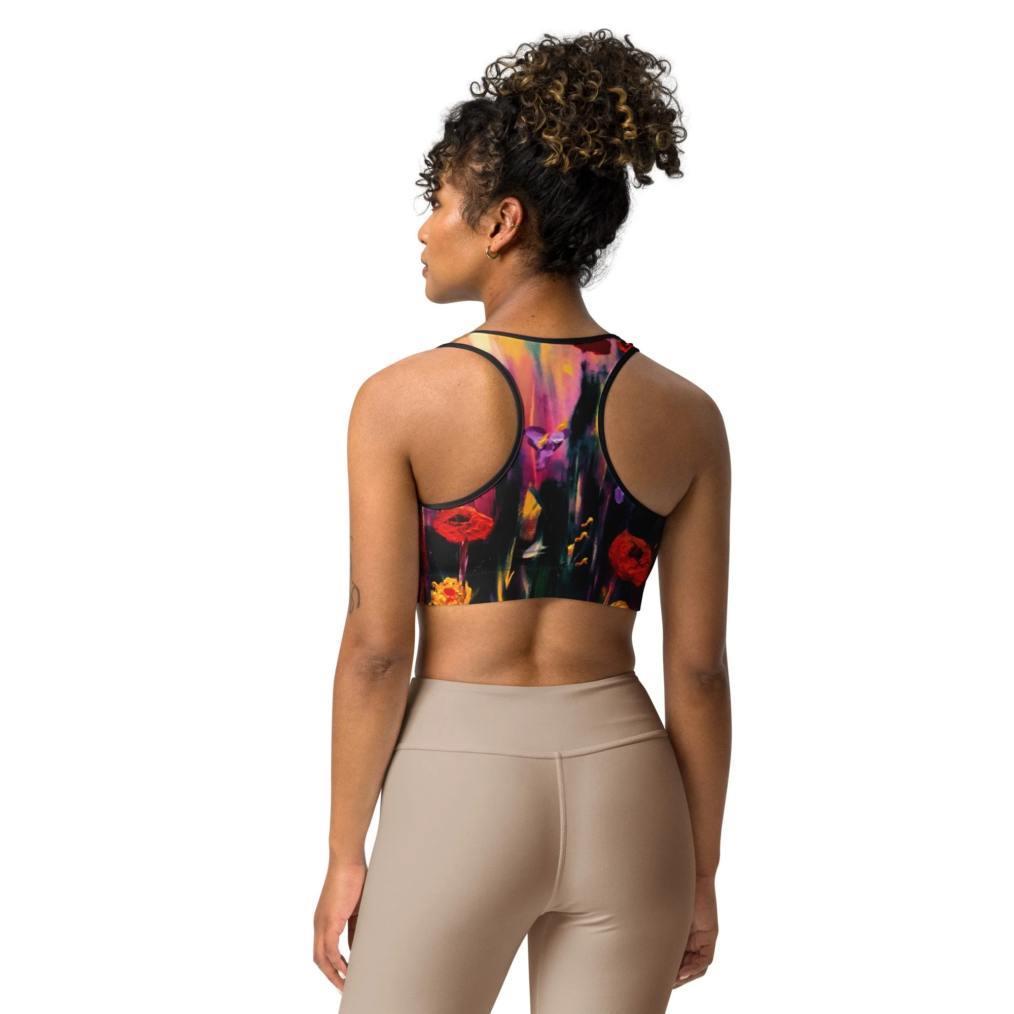 Women’s sports bra featuring a vibrant poppy floral print, combining bold botanical artwork with a comfortable, supportive athletic design for active and everyday wear.