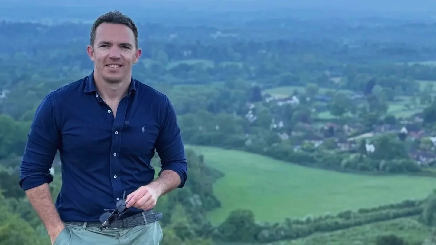 Matt Harverson, founder of Land Ventures, standing in farmland across the Home Counties