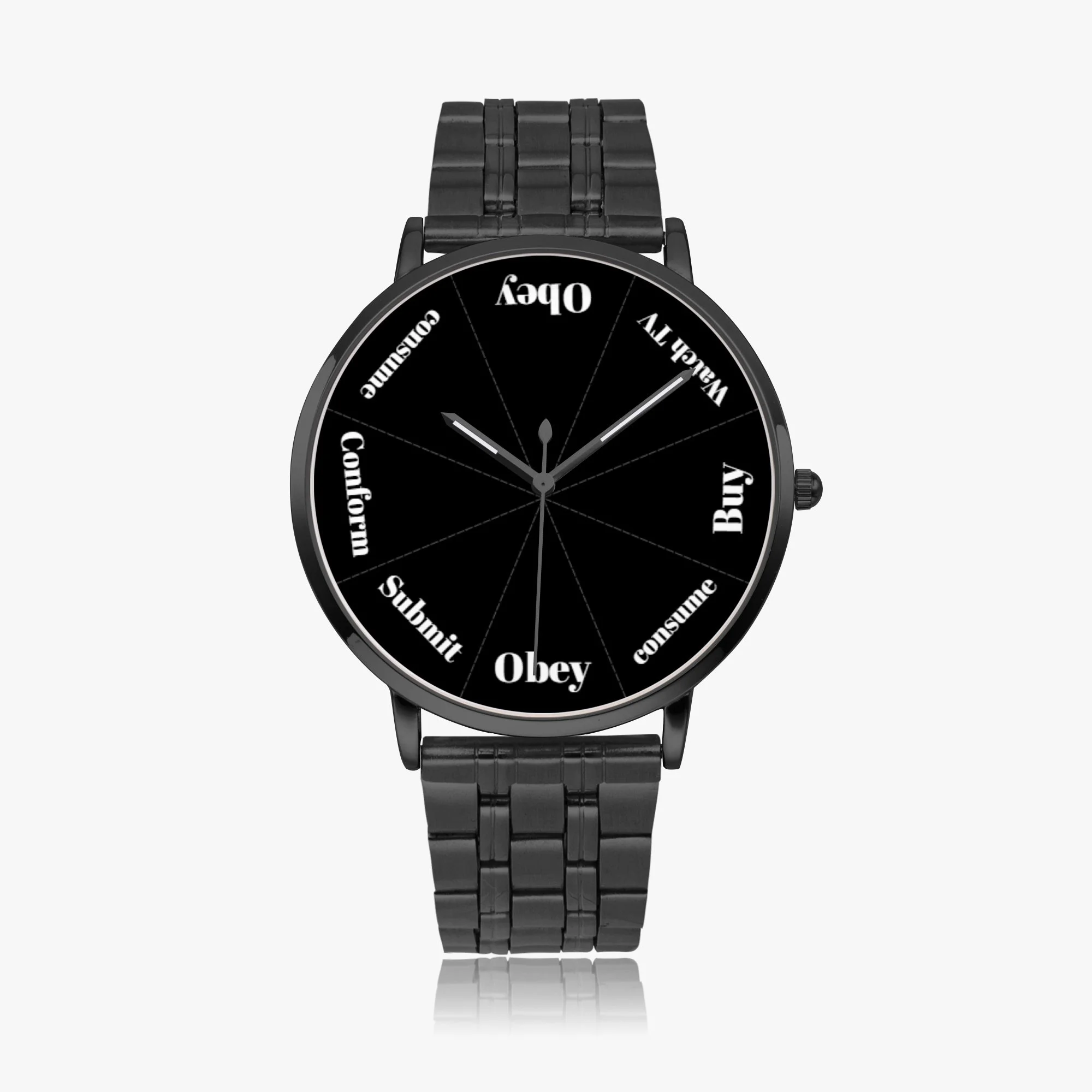 A black wristwatch with a round face, displaying words instead of numbers for the hours, including 'Buy', 'Wealth', 'Obey', 'Submit', 'Conform', 'Control', 'Consume', and 'Oub'. The watch has black metal band links.