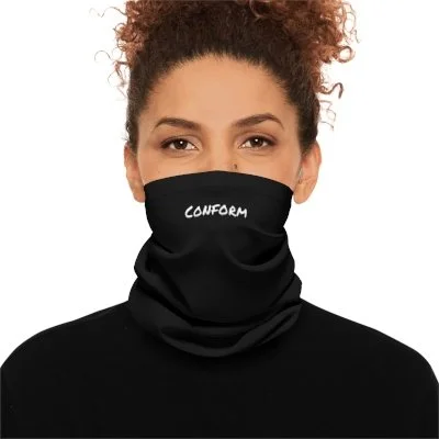 A woman with curly hair wearing a black neck gaiter with the word 'CONFORM' written on it.