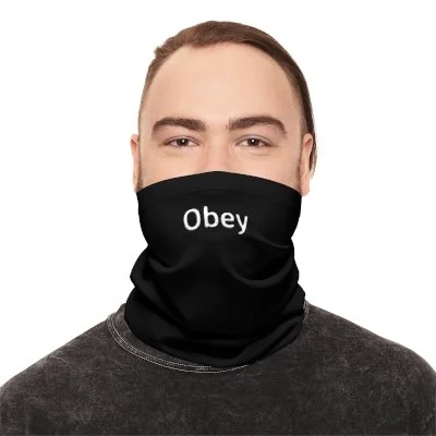 A person wearing a black neck gaiter with the word 'Obey' printed on it in white.