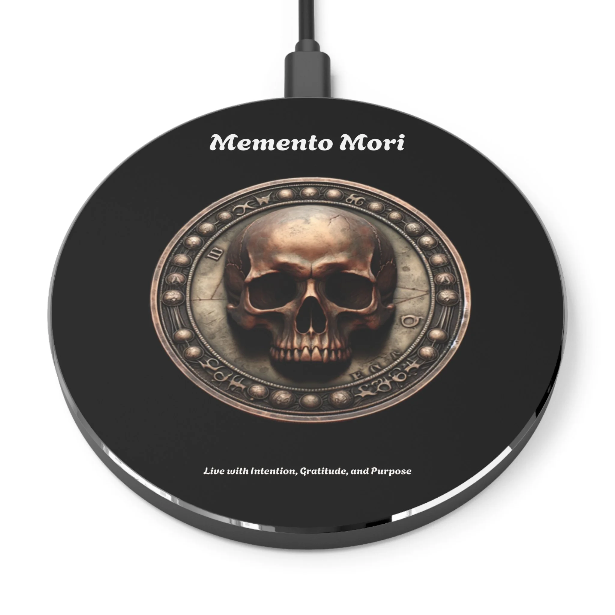 A round black object with a skull in the center, surrounded by a decorative border resembling a clock or compass. The text 'Memento Mori' is at the top, and at the bottom, it says 'Live with Intention, Gratitude, and Purpose'.