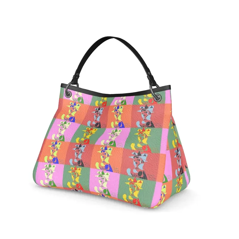 Colorful handbag with a pattern of stylized cats in various colors and poses, featuring a checkered background, black handle, and silver rings attaching the handle