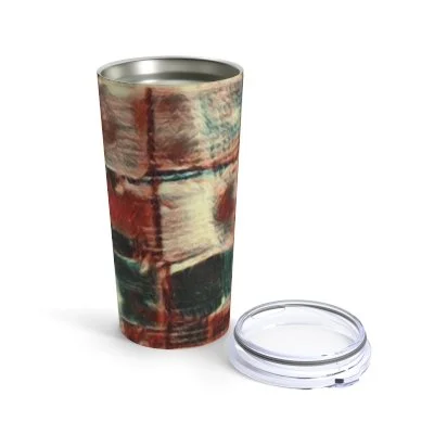 A metallic tumbler with a multicolored abstract design and a transparent plastic lid placed next to it on a white background.
