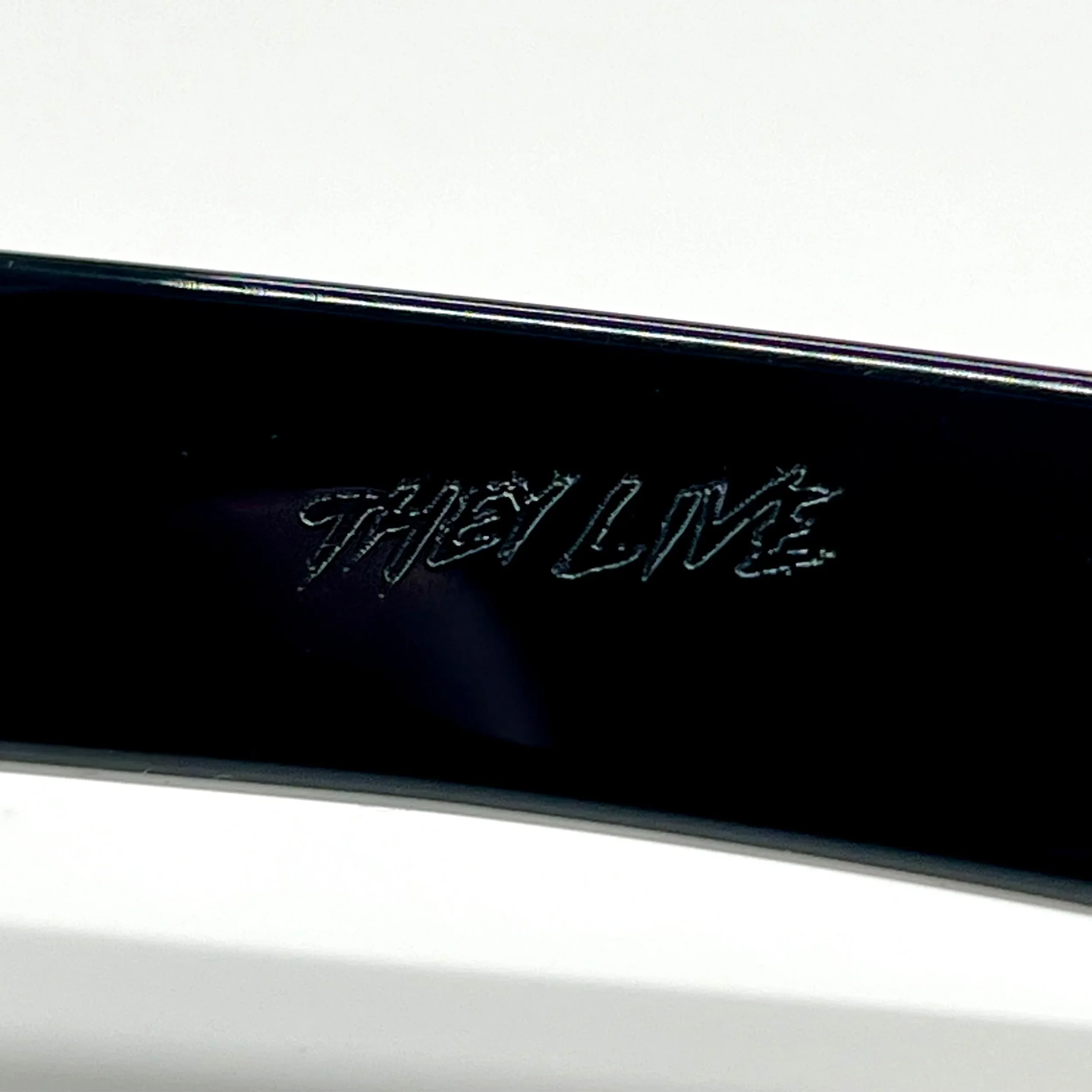 THEY_LIVE_GLASSES_ARM_LOGO_DETAIL_WEB.webp