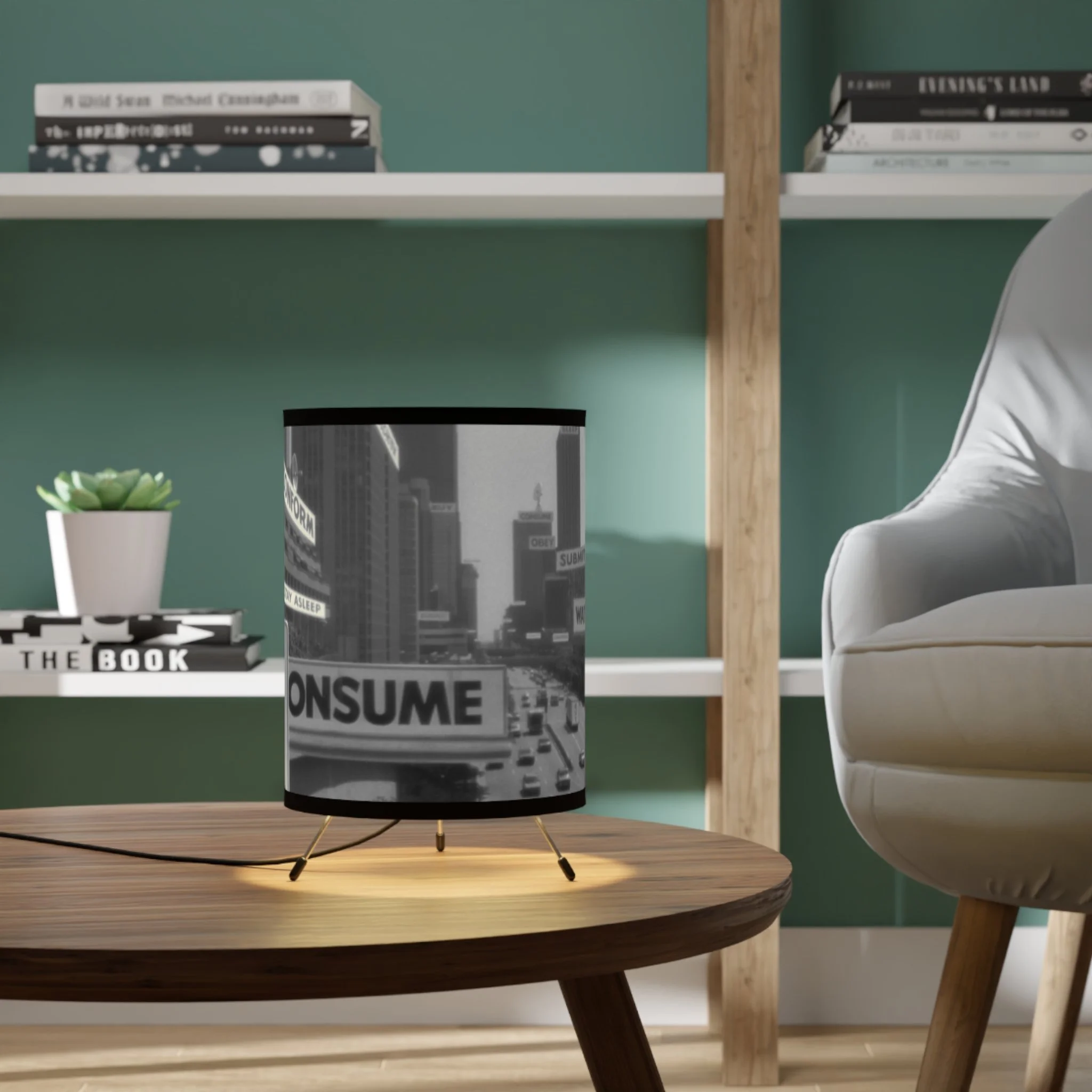 A black and white lamp with a cityscape and protest signs, including the word "CONSUME" on a large billboard, on a wooden table in a modern living room.