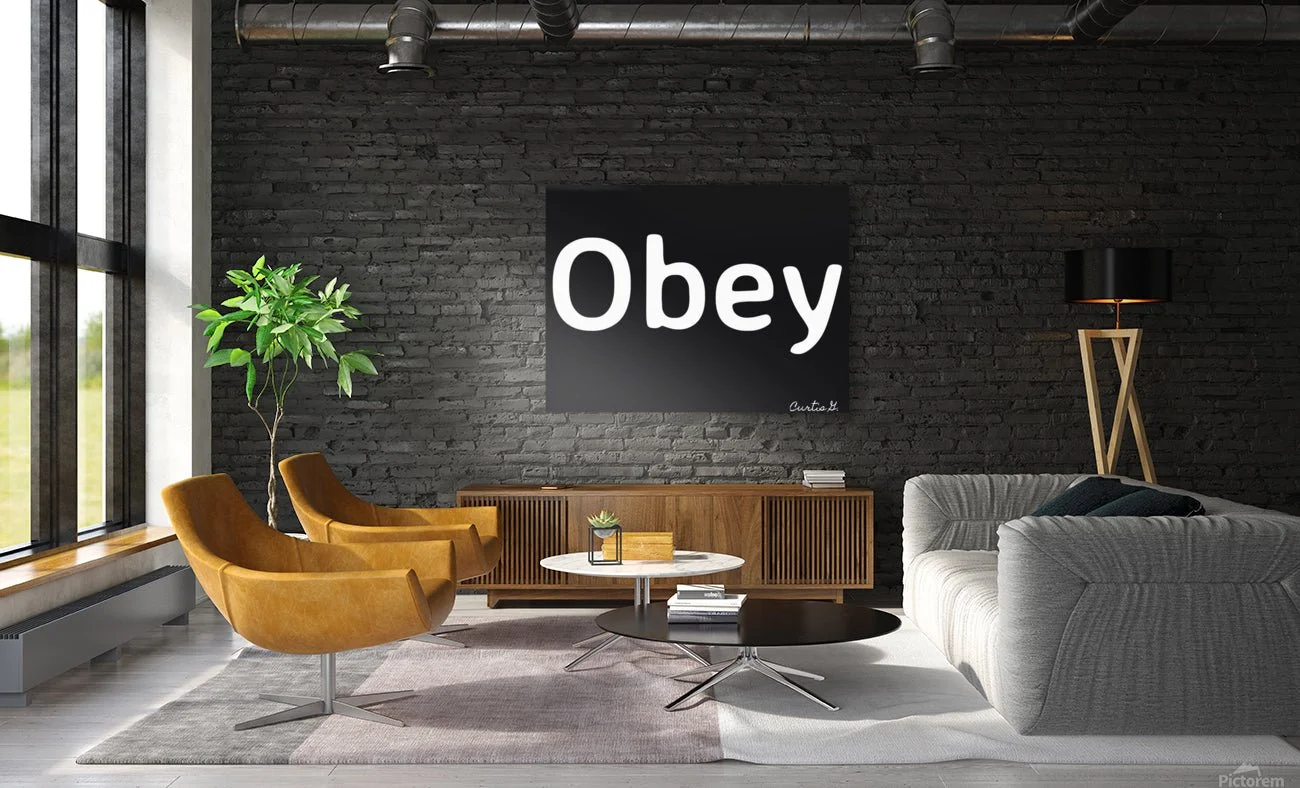 Modern living room with large windows, black brick wall, a black art piece with the word 'Obey', two mustard-colored chairs, a grey sofa, a wooden TV stand, a black and white marble coffee table, a tall floor lamp, and a potted plant.