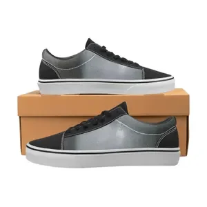 Pair of black and gray sneakers on a shoebox.