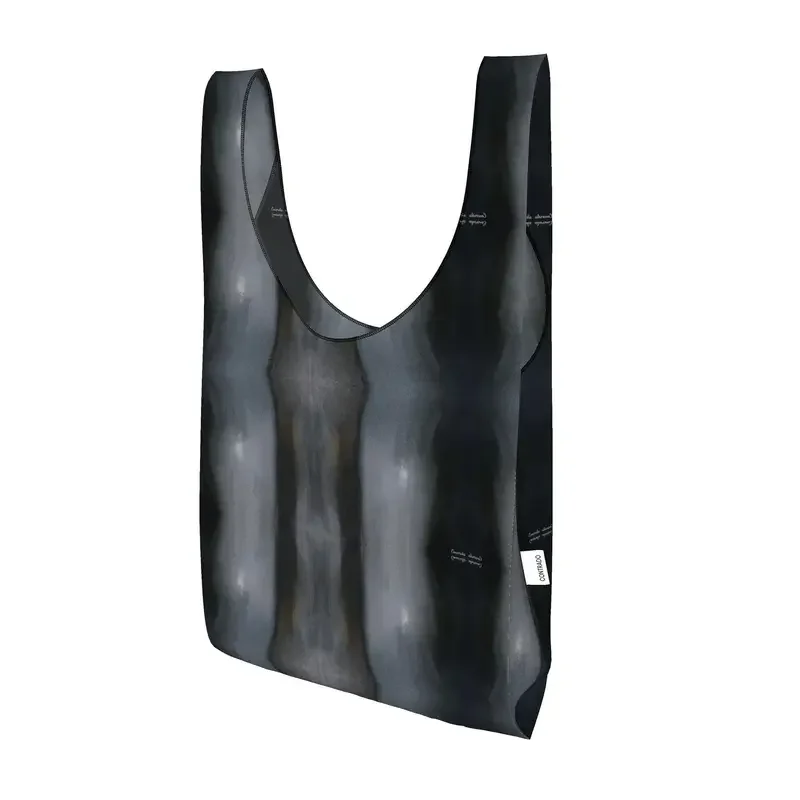 Reusable shopping tote bag with an abstract black, gray, and white design.