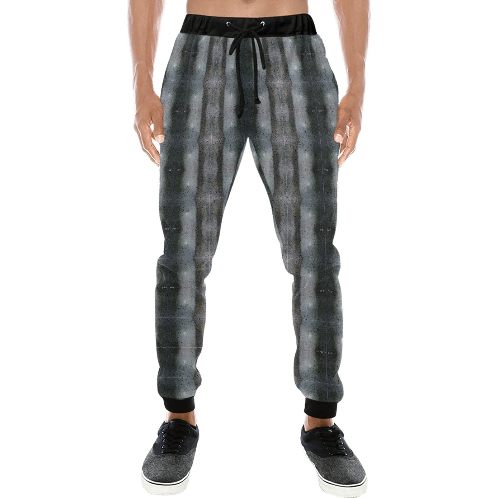 Person wearing black and gray patterned jogger pants with black sneakers