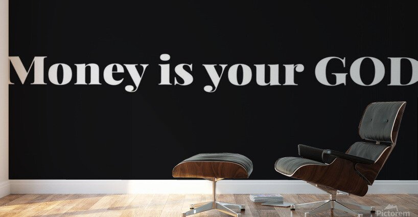 Modern black wall with large white text that reads 'Money is your GOD,' next to a black leather lounge chair and matching ottoman in a room with wooden flooring.