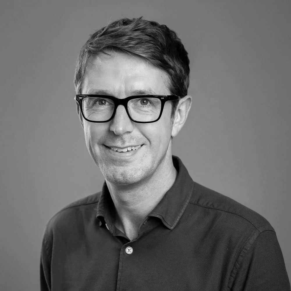 a black and white photo of James Healy, leadership coach at OMA.