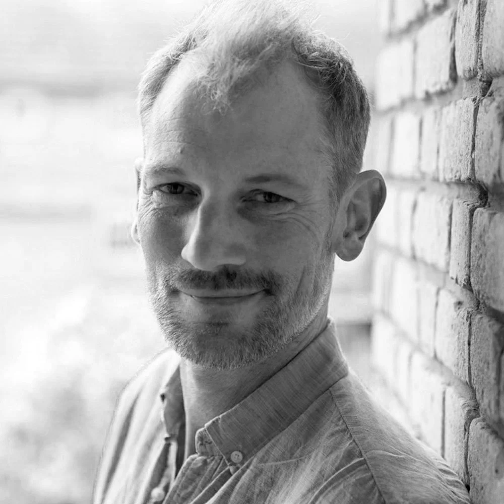 a black and white photo of Edward Nelson, leadership coach at OMA.