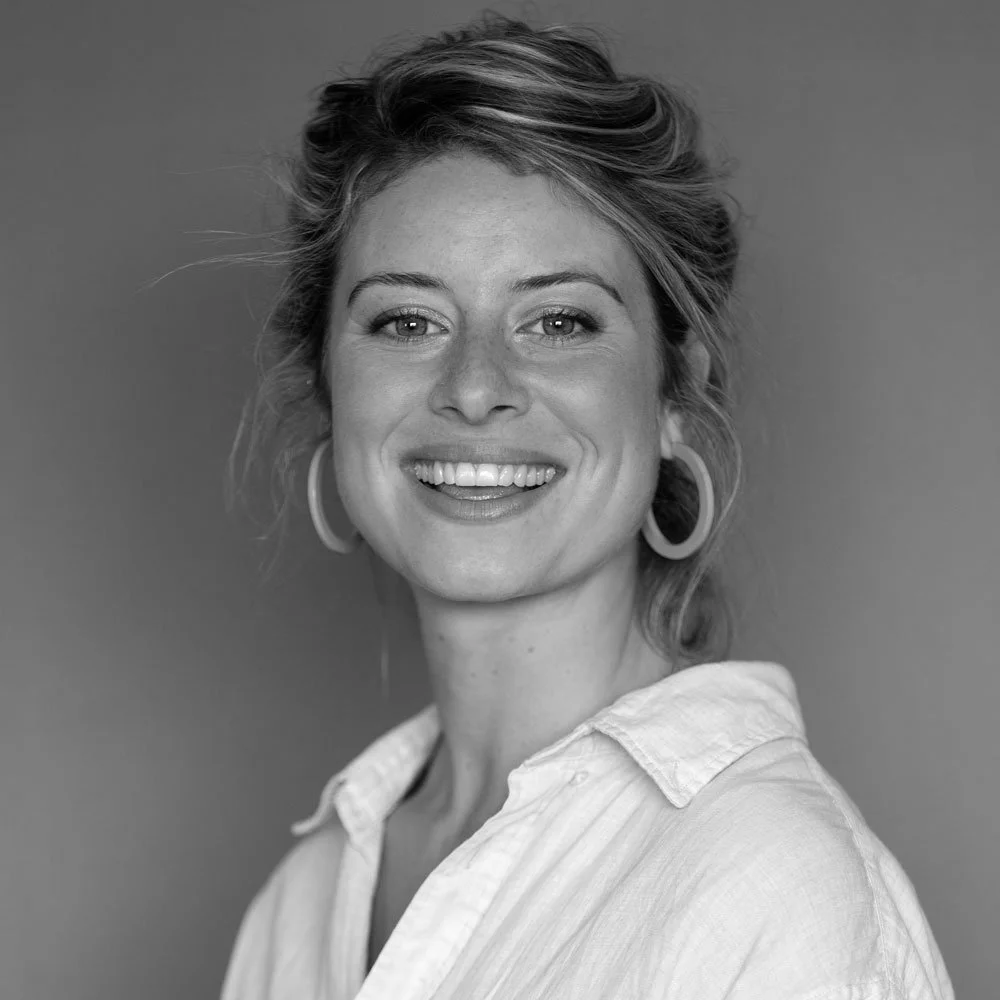 a black and white photo of Hebe Dickins, leadership coach at OMA.