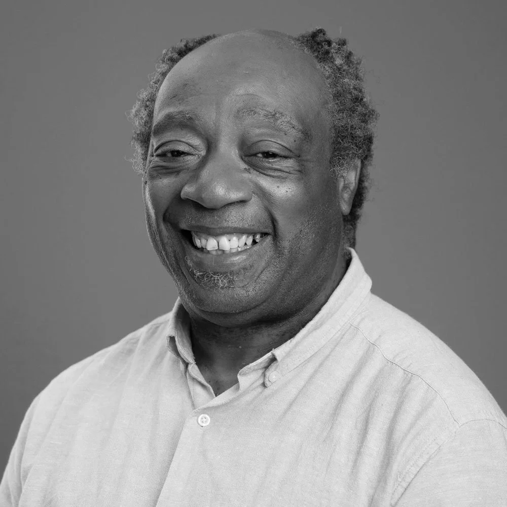a black and white photo of Conroy Harris, leadership coach at OMA.