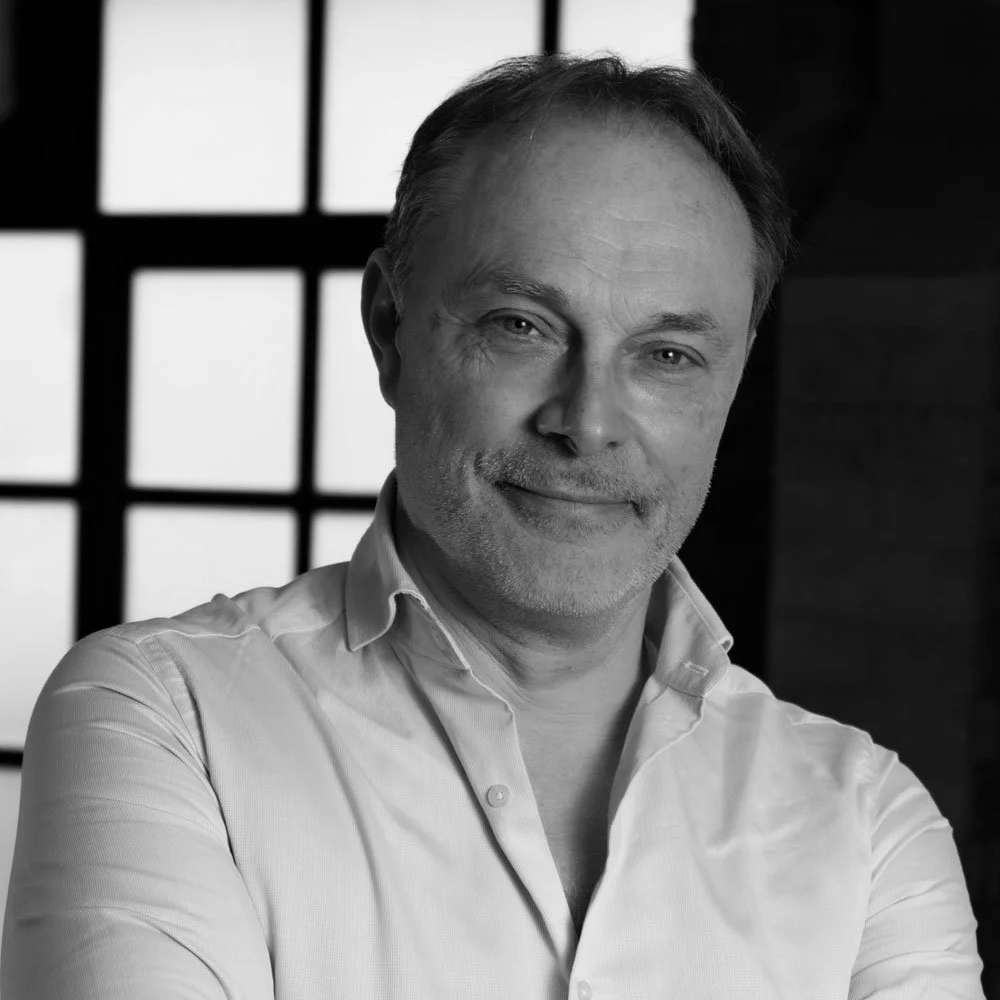 a black and white photo of Ben Walden, founding partner at OMA.