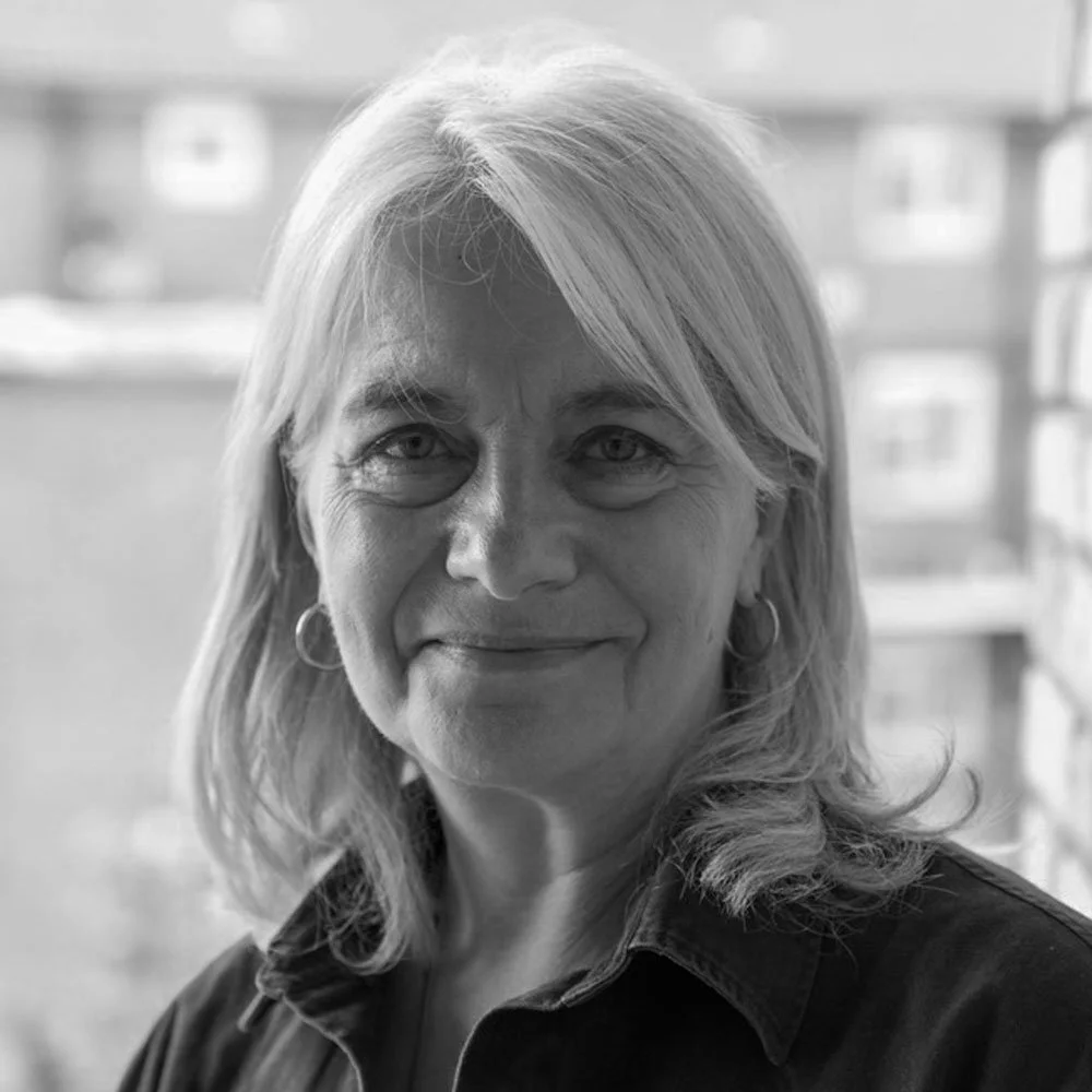 a black and white photo of Julia St John, leadership coach at OMA.
