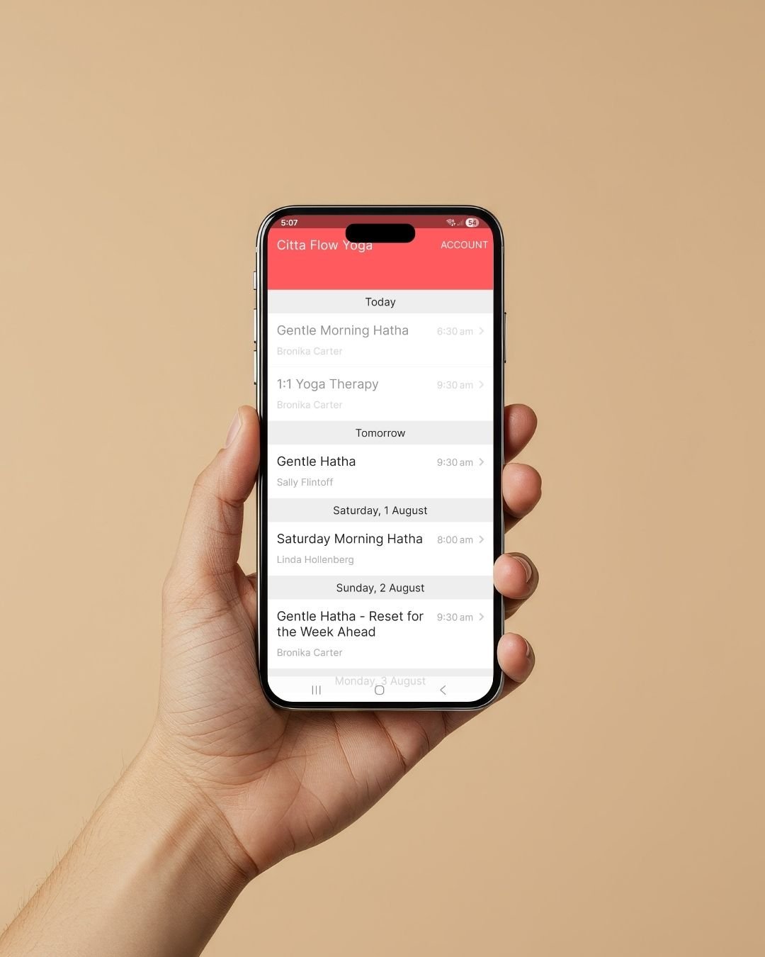 hand holding Citta Flow yoga mobile app