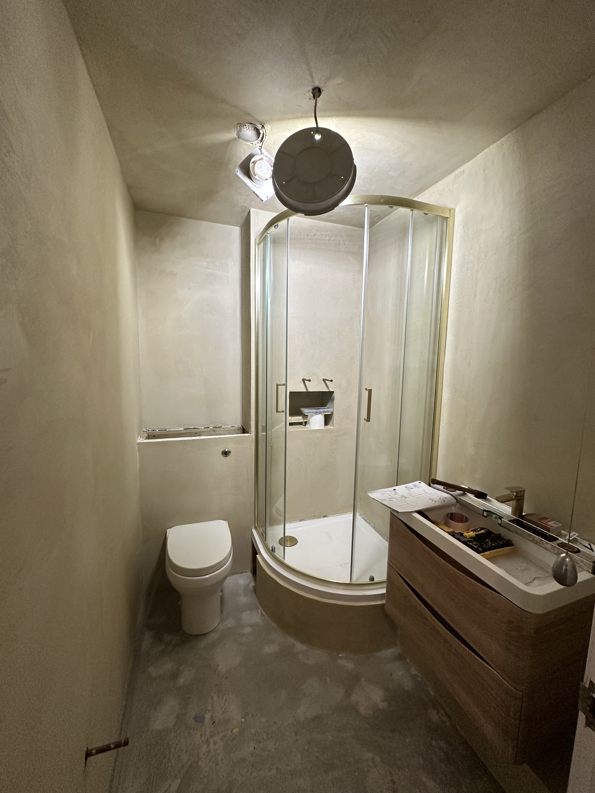 Full ensuite bathroom renovation, including shower quadrant platform build, boxing of back of shower and cistern and plumbing below the tray, toilet installation with recessed cistern, hanging vanity, tap plumbing and sink waste. The walls were tanke