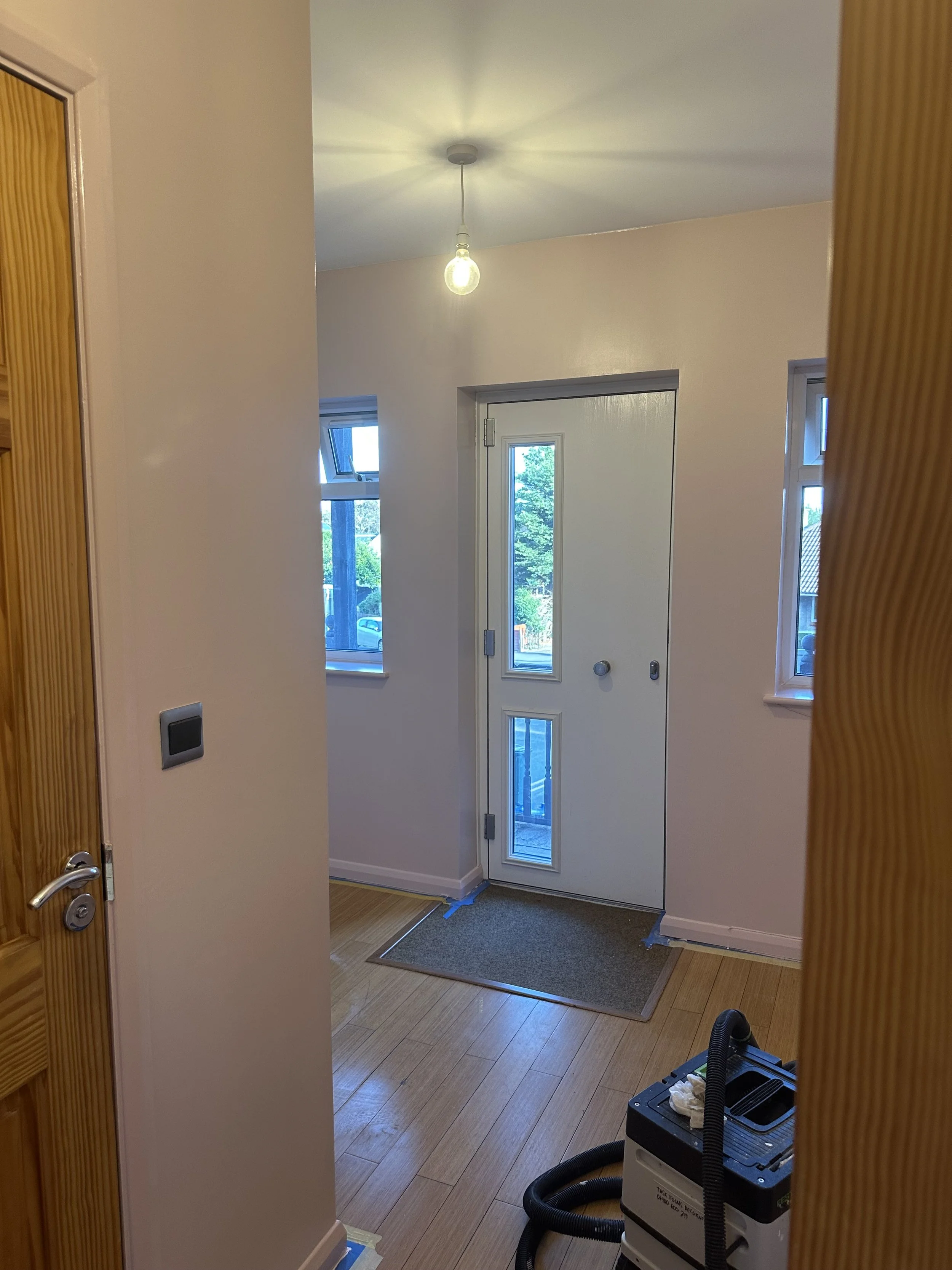 Entrance hallway painted in pink vinyl silk paint by Albany, the woodwork is matched in colour with a satin finish.