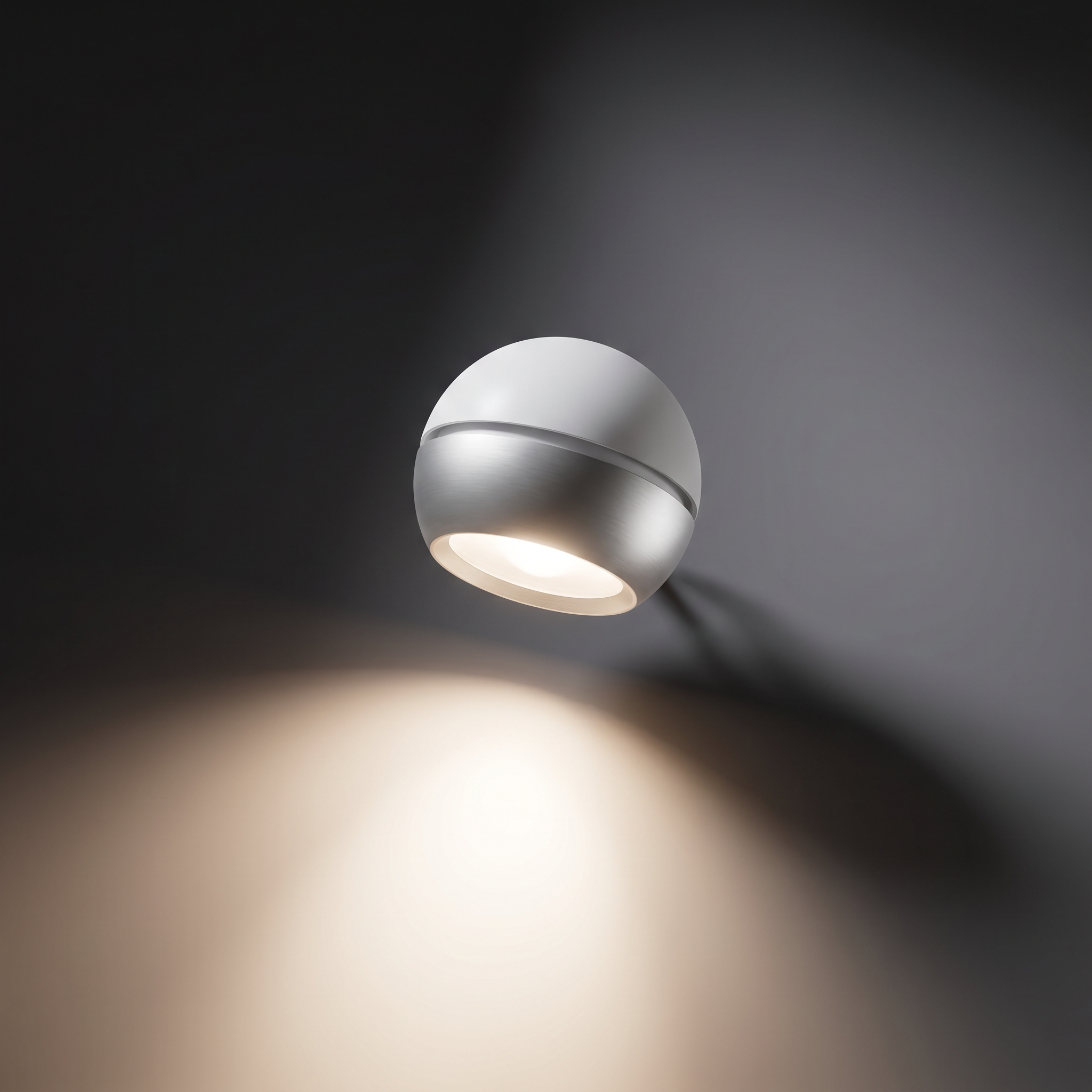 Modern ceiling light fixture with a spherical shape and metallic finish, illuminating a dark room.