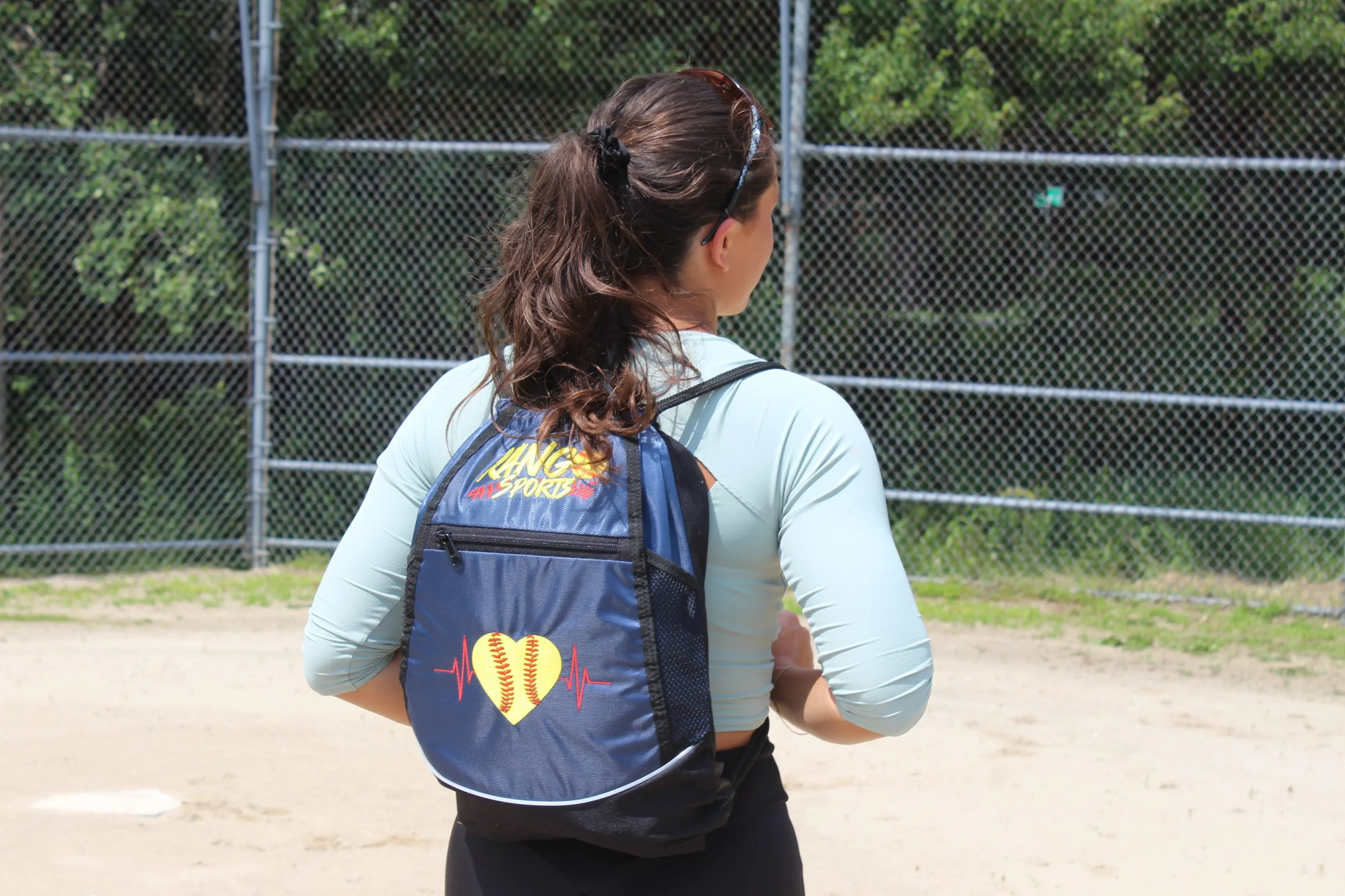 softball player with rango sports drawstring bag