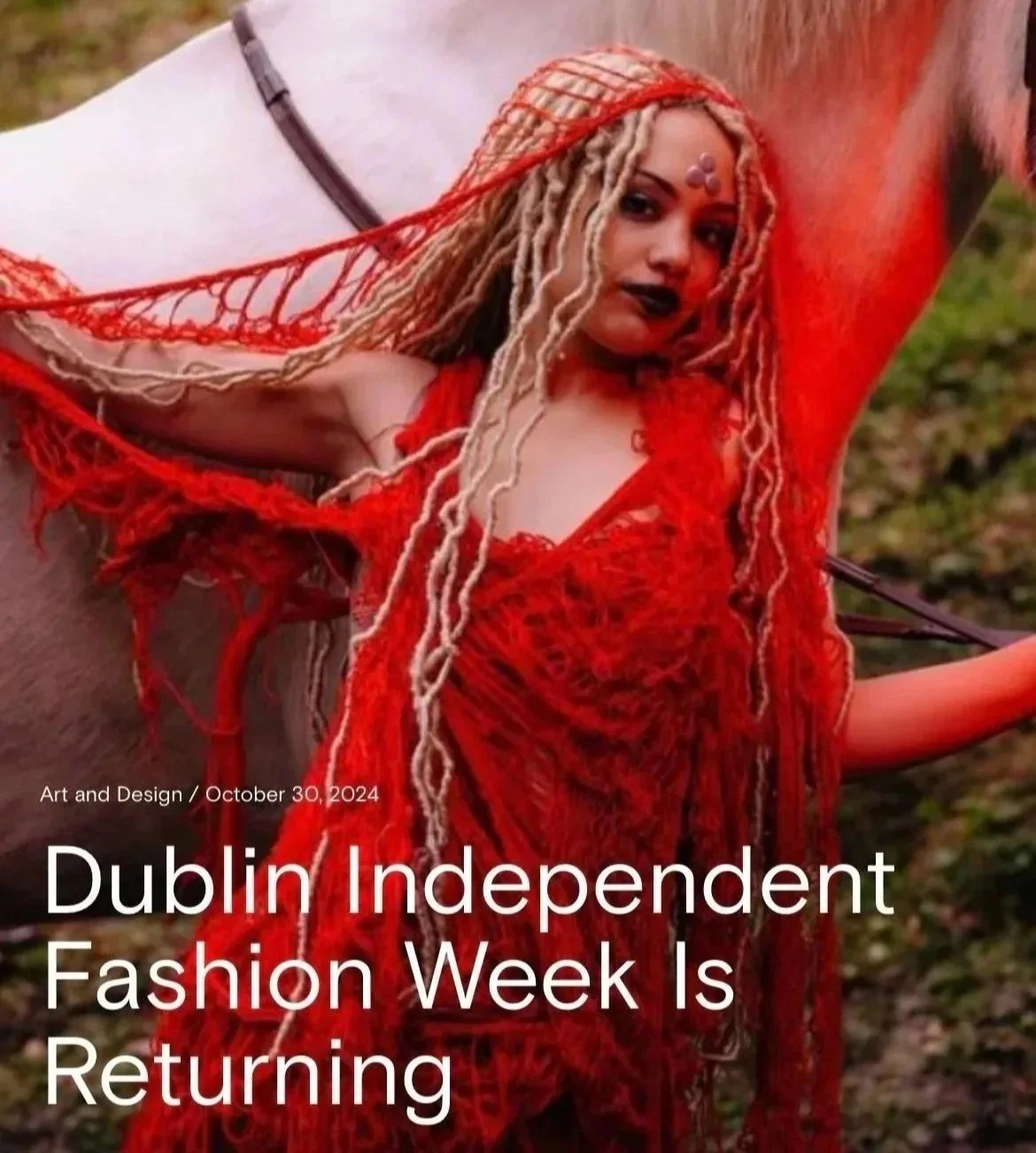 A woman with long beige braids in a red, textured outfit outdoors, with a blurred natural background. Text overlay reads "Dublin Independent Fashion Week Is Returning" along with "Art and Design / October 30, 2024."