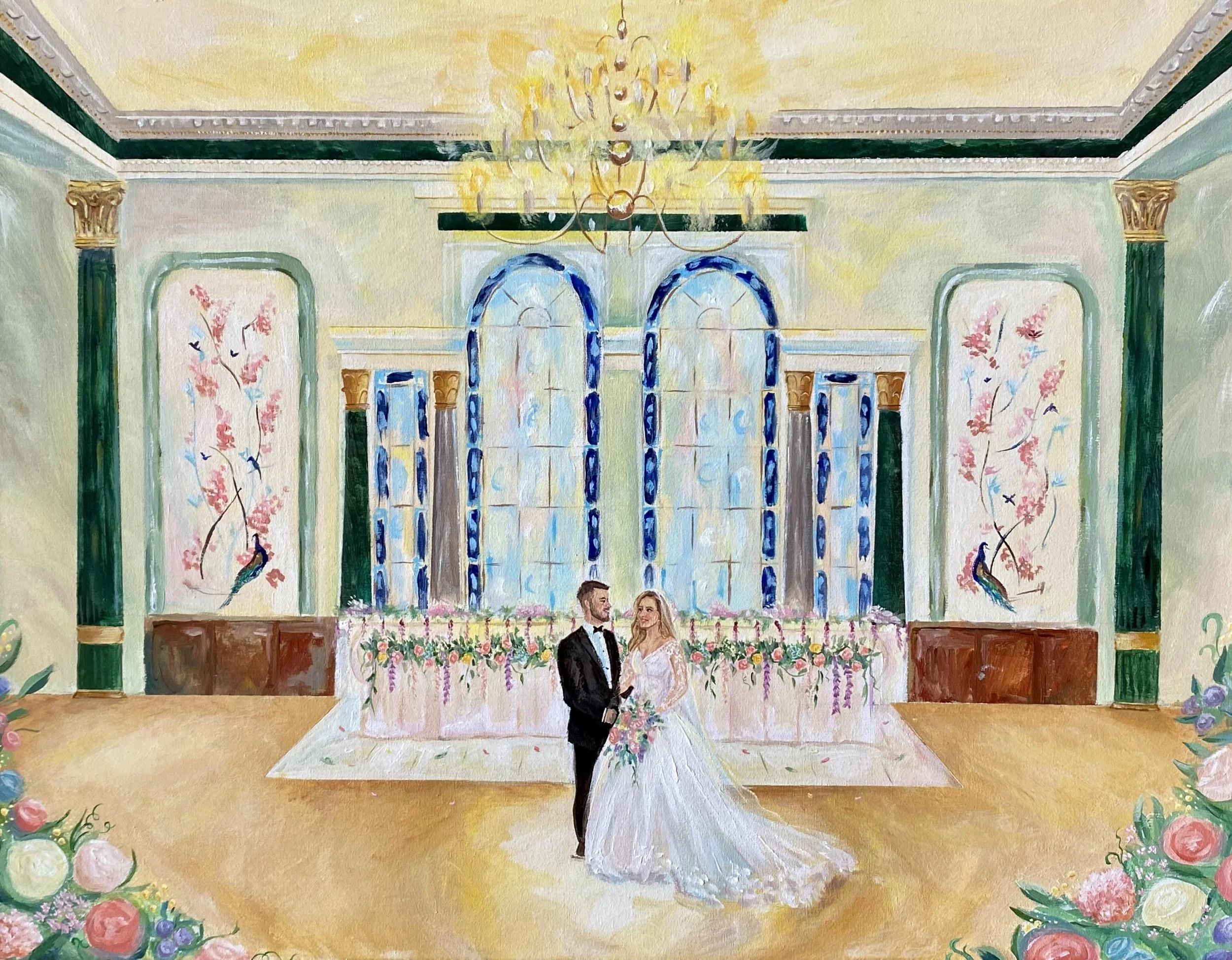 A wedding couple stands in front of a large, ornate window with stained glass, inside a decorated hall with floral patterns and a chandelier overhead.