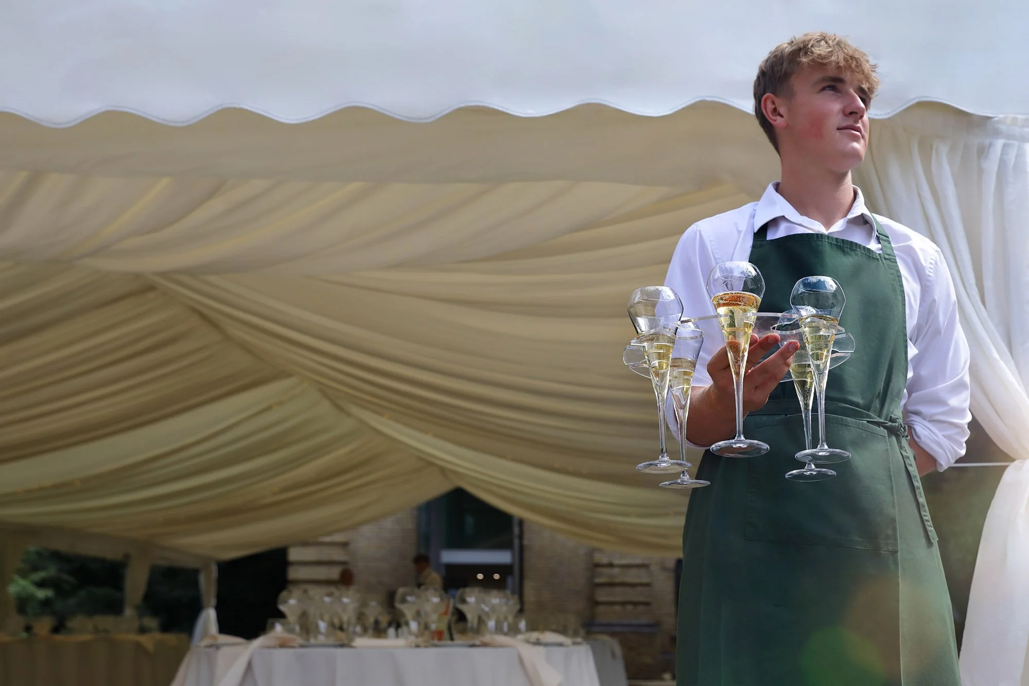Archie serving Champagne for Raquel's staffing & events team at the Pump House Battersea