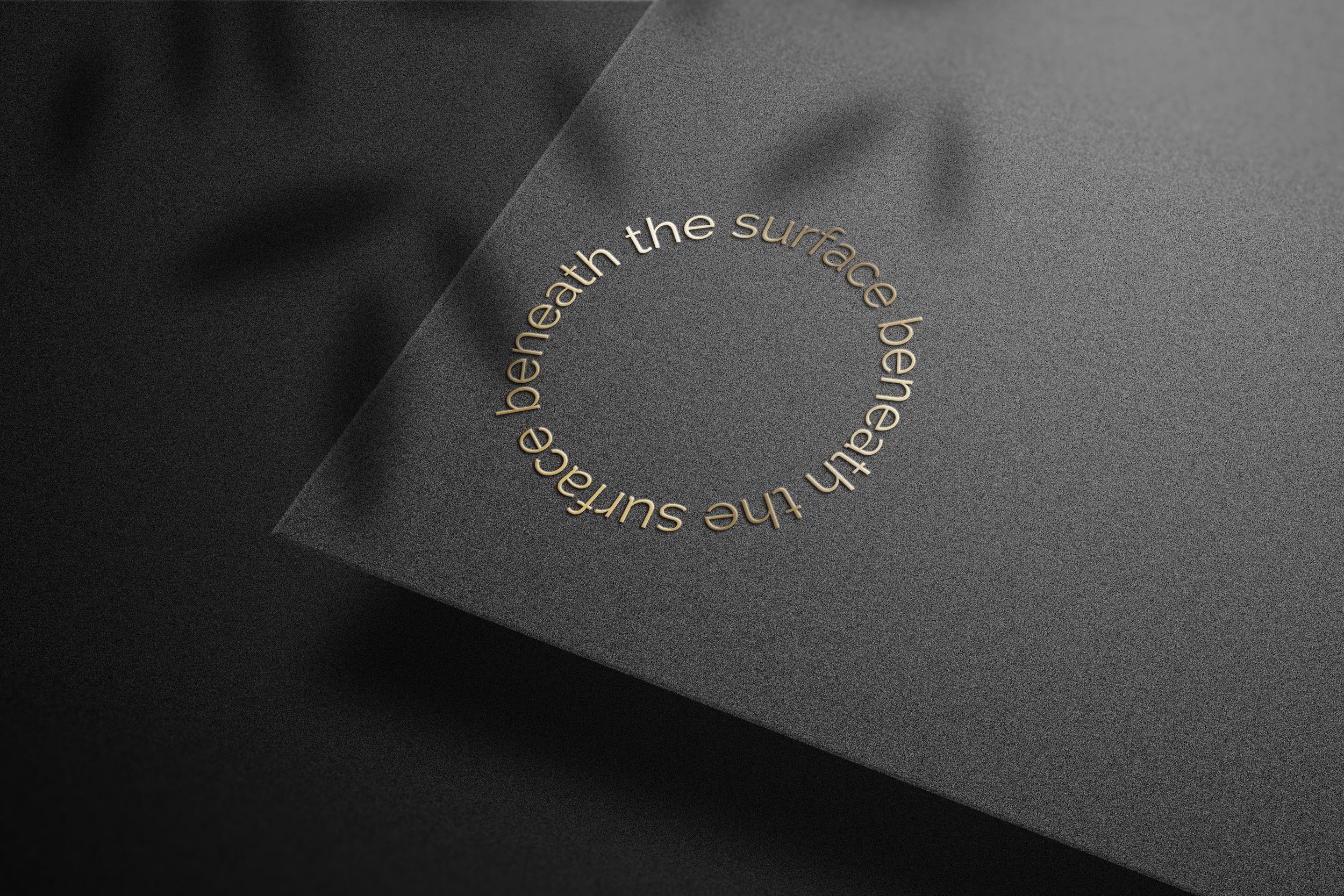 Beneath-the-Surface---logo-on-black-paper.jpg