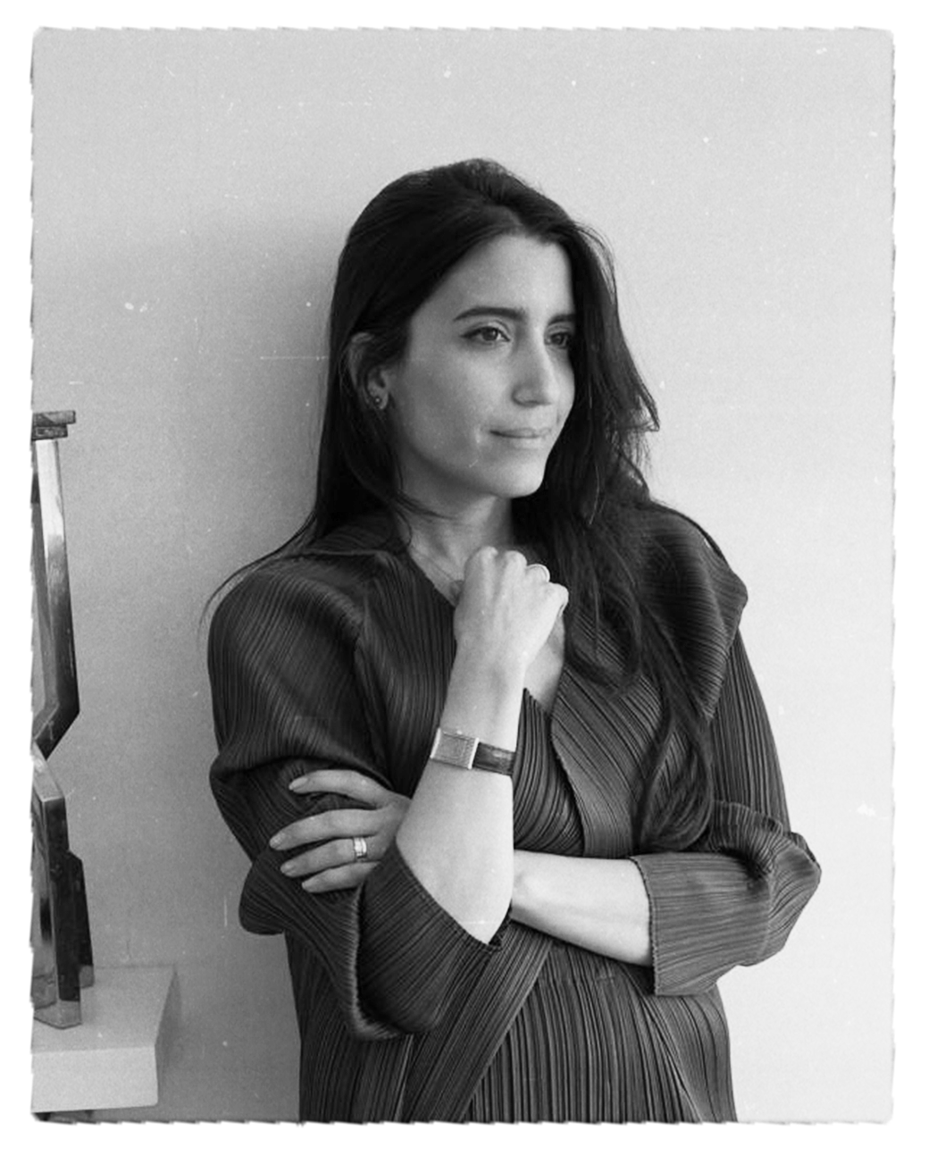 Black and white portrait of a woman with long dark hair, wearing a dark striped dress, standing against a plain background, Beef Design Studio, Brand strategy, Brand identity, visual identity, graphic design, testimonial