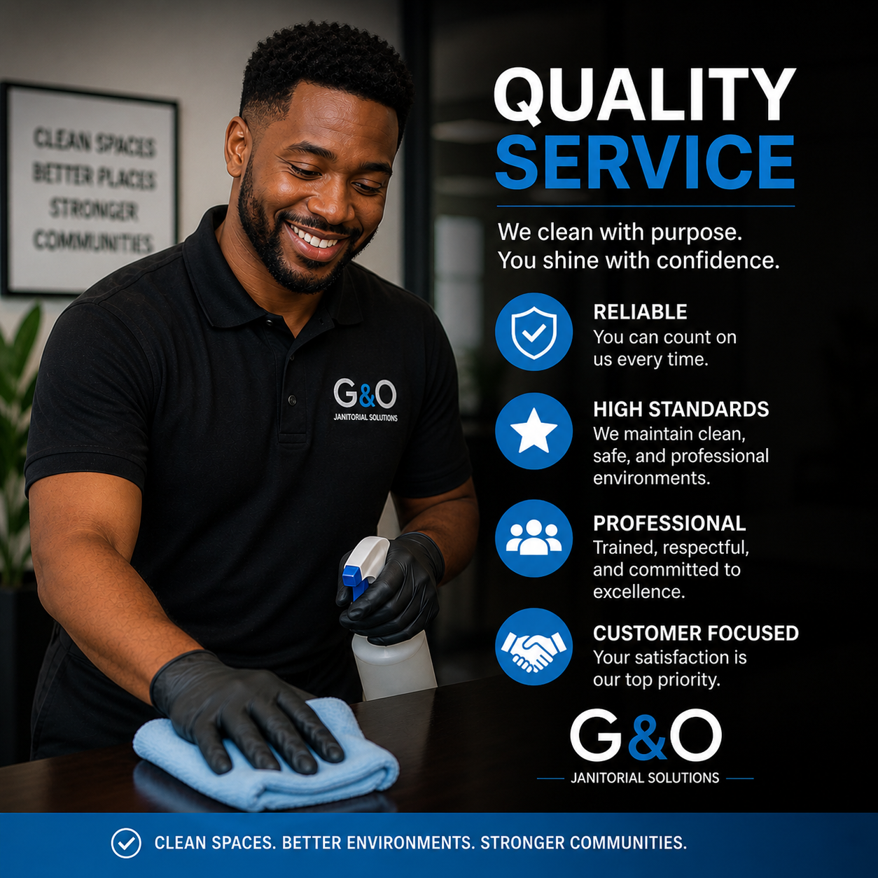 A smiling man wearing a black polo shirt with the logo G&O Janitorial Solutions, cleaning a surface with a spray bottle and a cloth in an office setting.