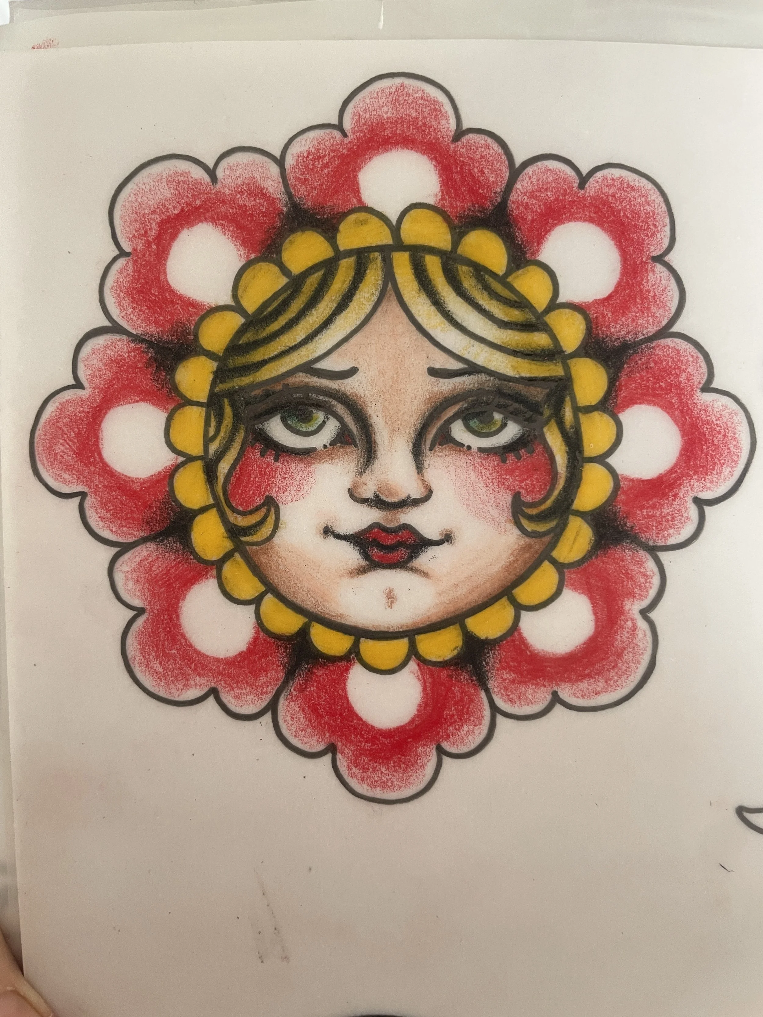 Colorful drawing of a woman's face surrounded by a floral pattern with red flowers, black outlines, yellow hair, and detailed facial features.