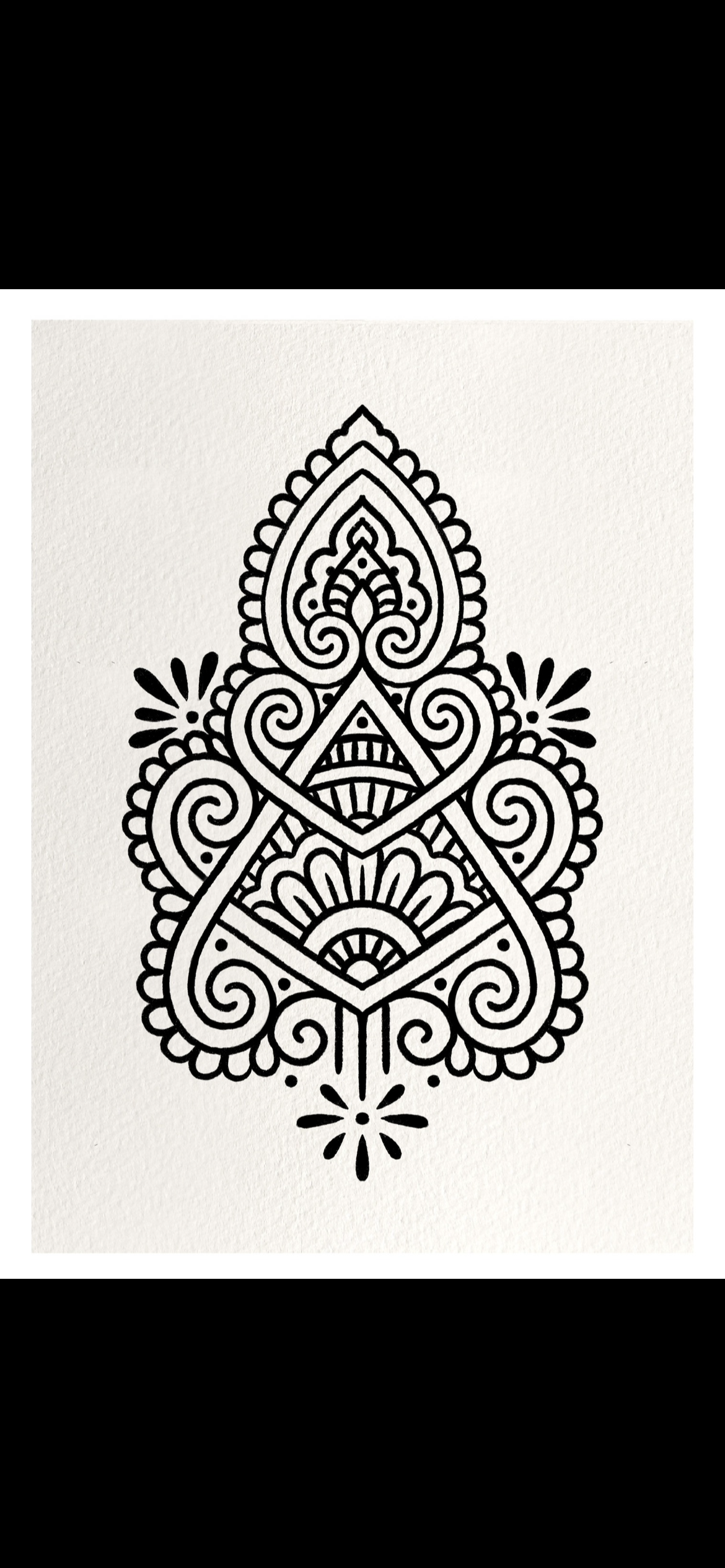 Black and white intricate mandala design on a white background.
