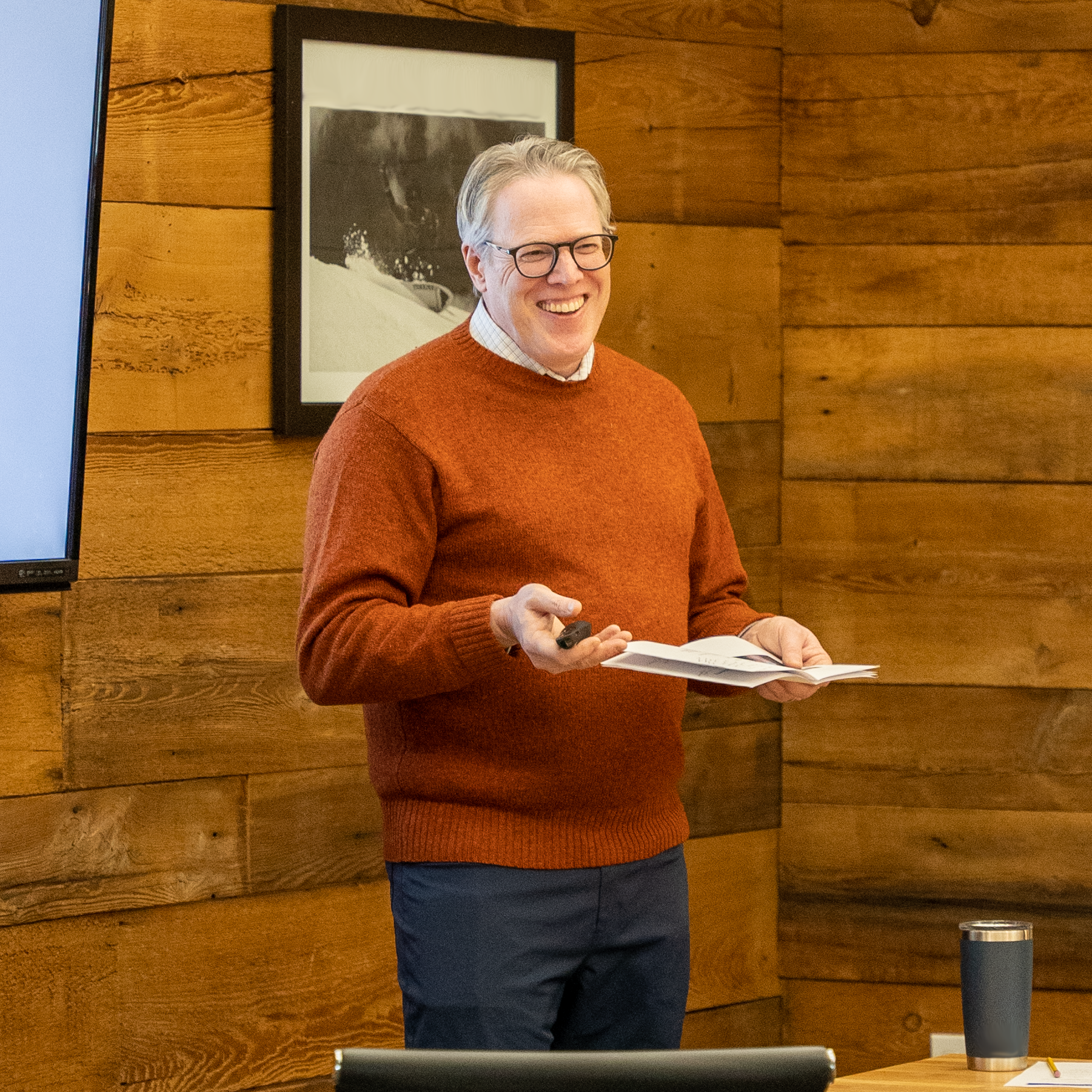 Peter Anderson presenting in front of an audience.