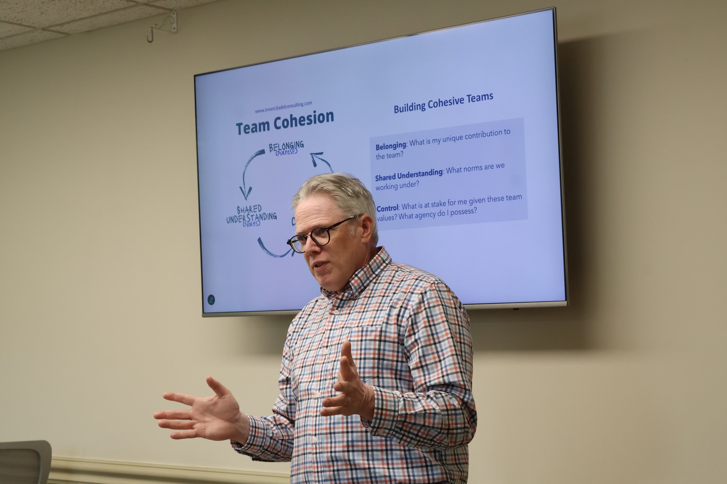 Executive Coach Peter Anderson presenting in front of a group.