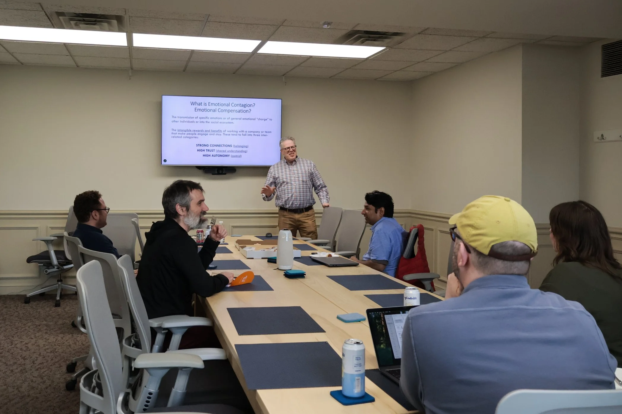 Peter Anderson presenting in front of a crowd.