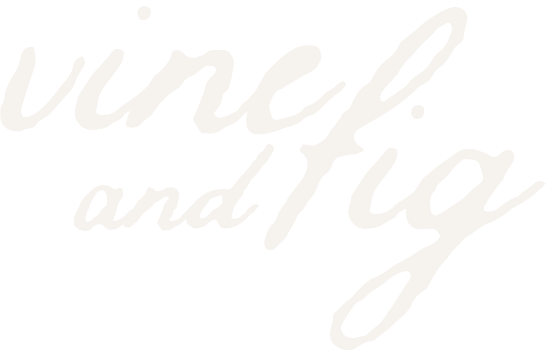 White handwritten style text on black background that says "Vine! and Fig"