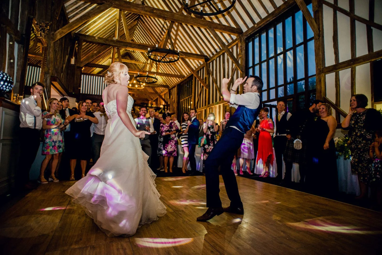 A bride and groom have a fun first dance at Essendon Country Club near Hatfield in Hertfordshire 