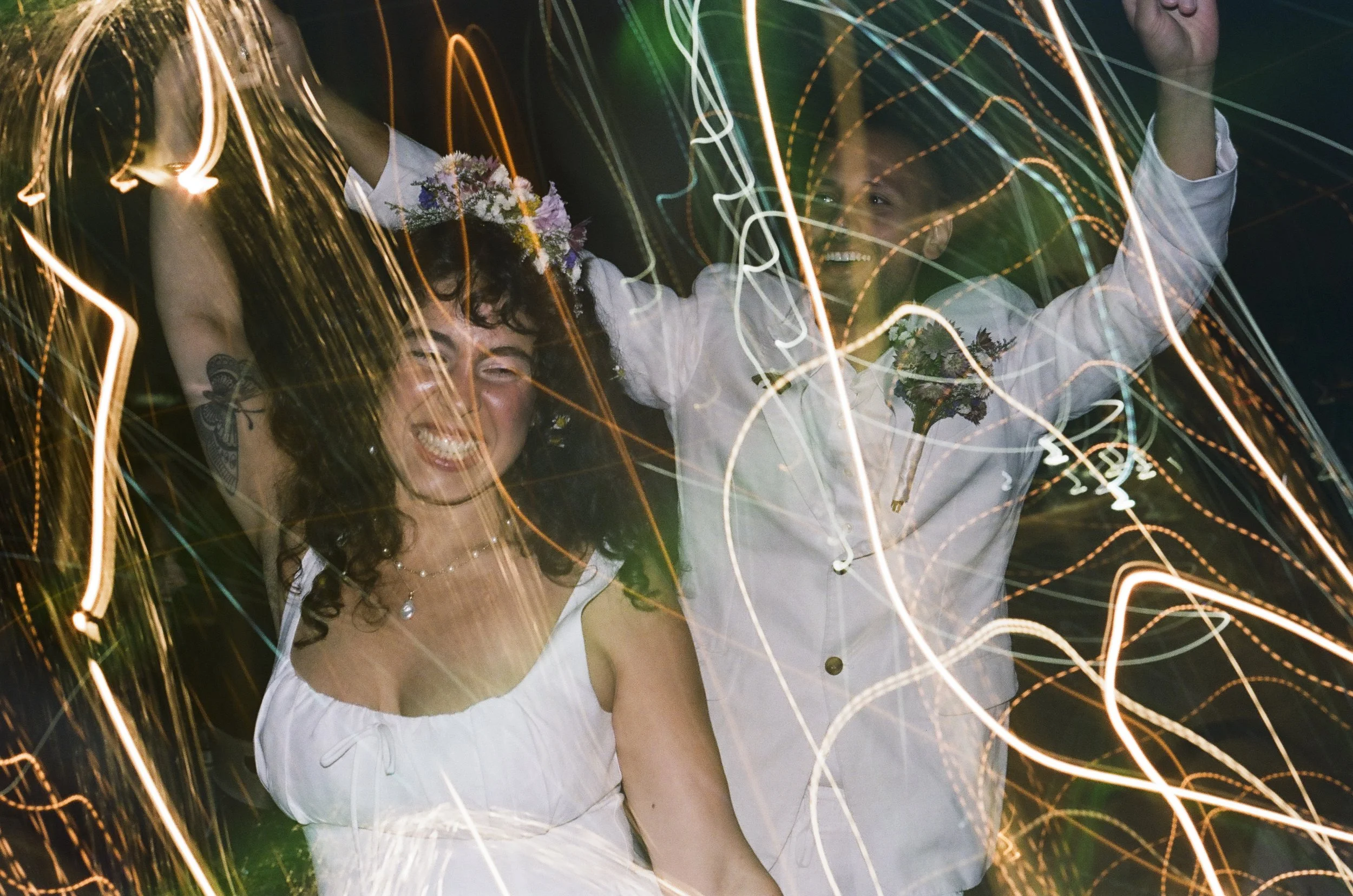Laurie’s customers, Evan and Kade, running down a mountain after getting married. 