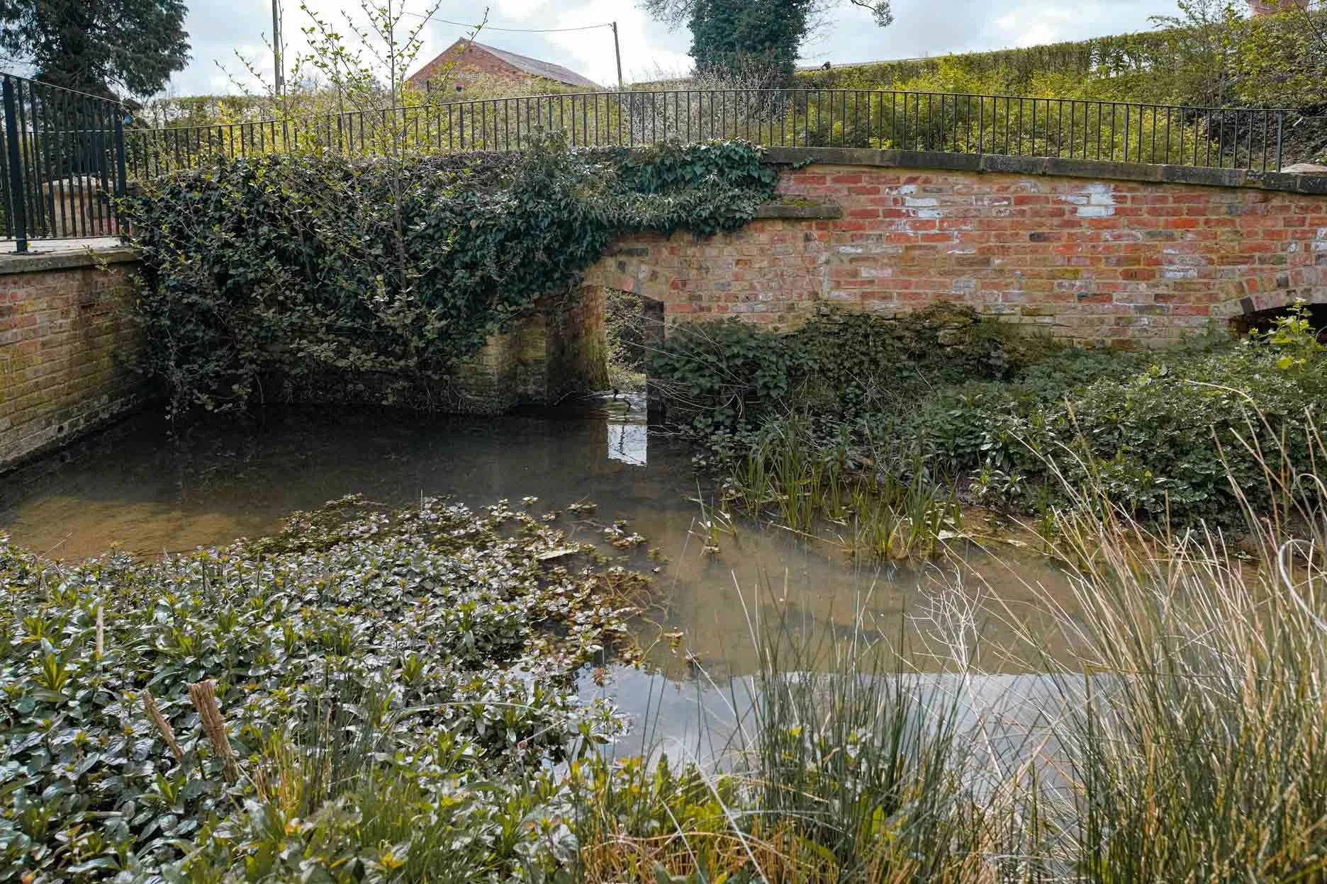 Cuttle Mill Training Room Hire Scenic Grounds with Pond and Bridge in Northampton