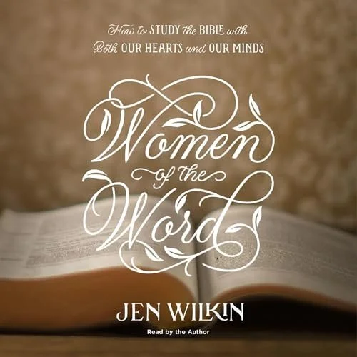 Book cover titled 'Women of the Word' by Jen Wilkin with subtitle 'How to Study the Bible with Both Our Hearts and Our Minds,' featuring an open Bible on a wooden surface.