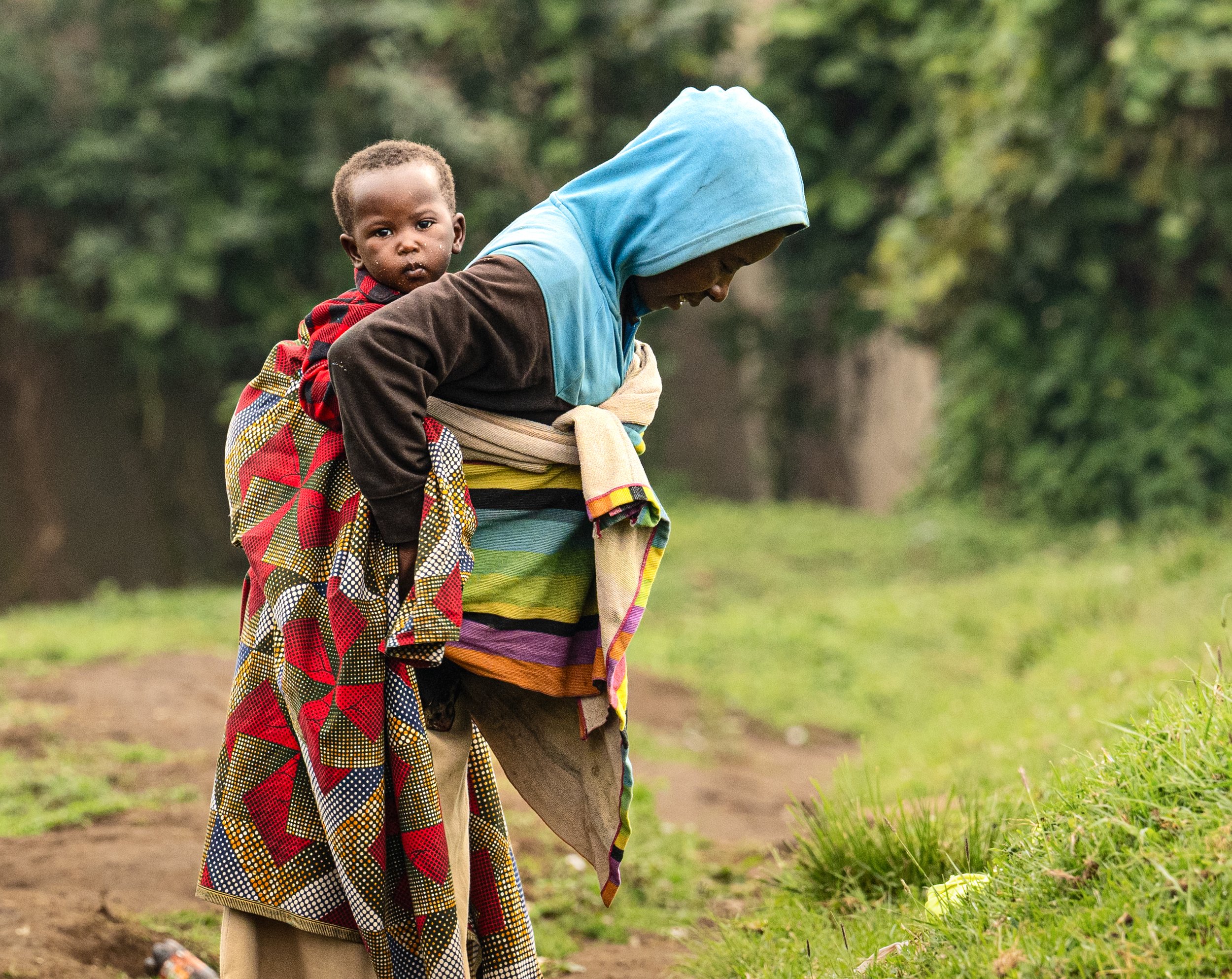 Woman with child in sling Rwanda.JPG