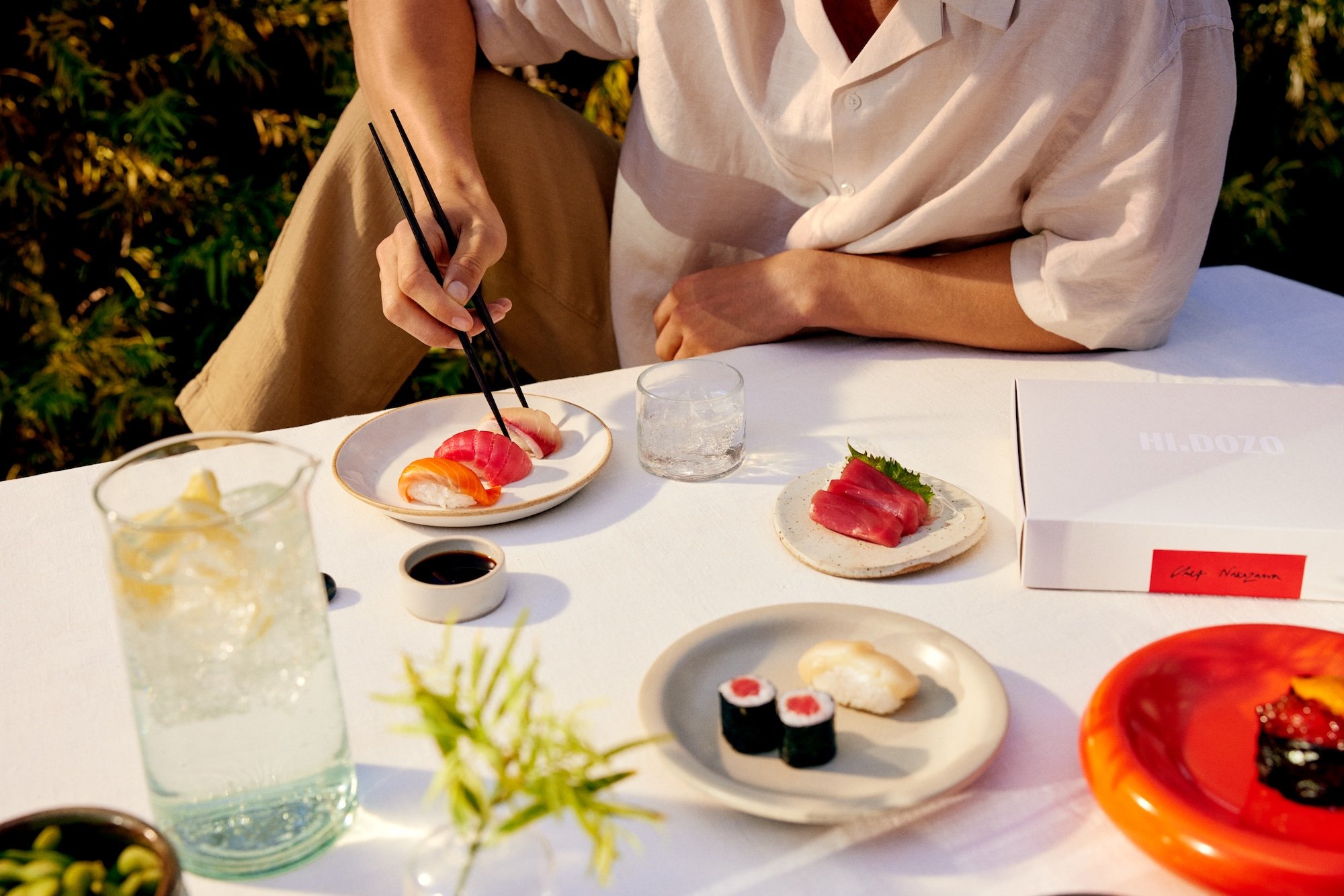 Person plating Hi.Dozo omakase sushi at home
