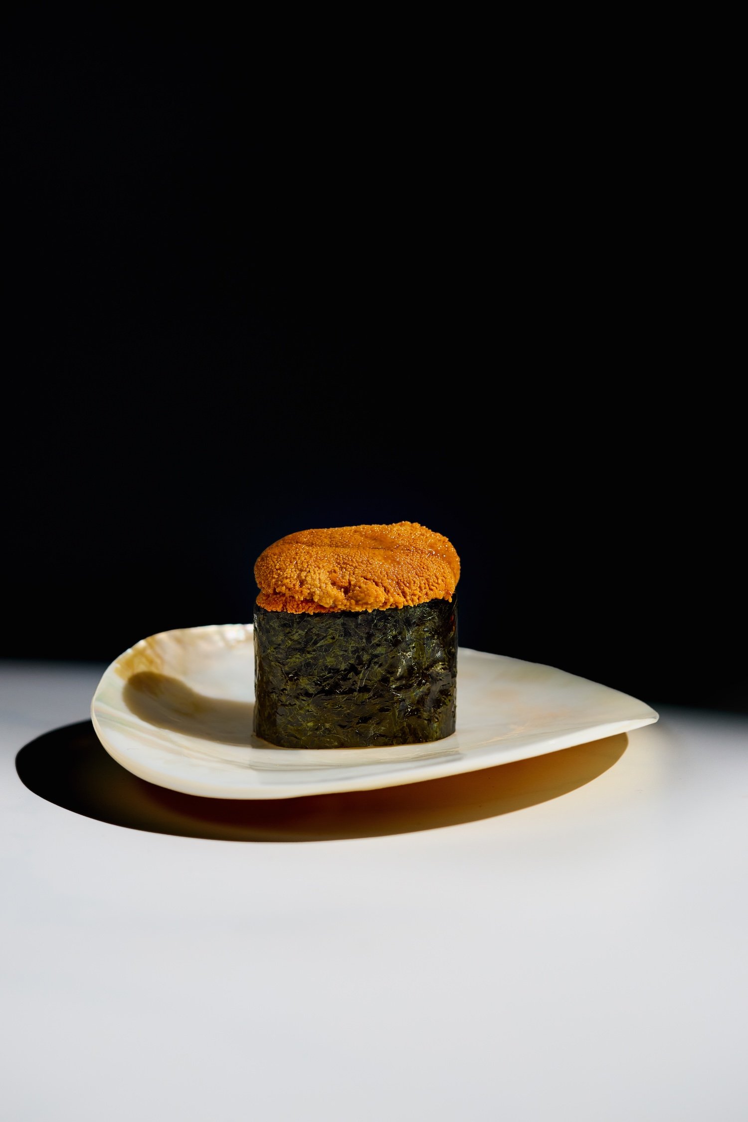 Hi.Dozo premium omakase nigiri sushi on dark background