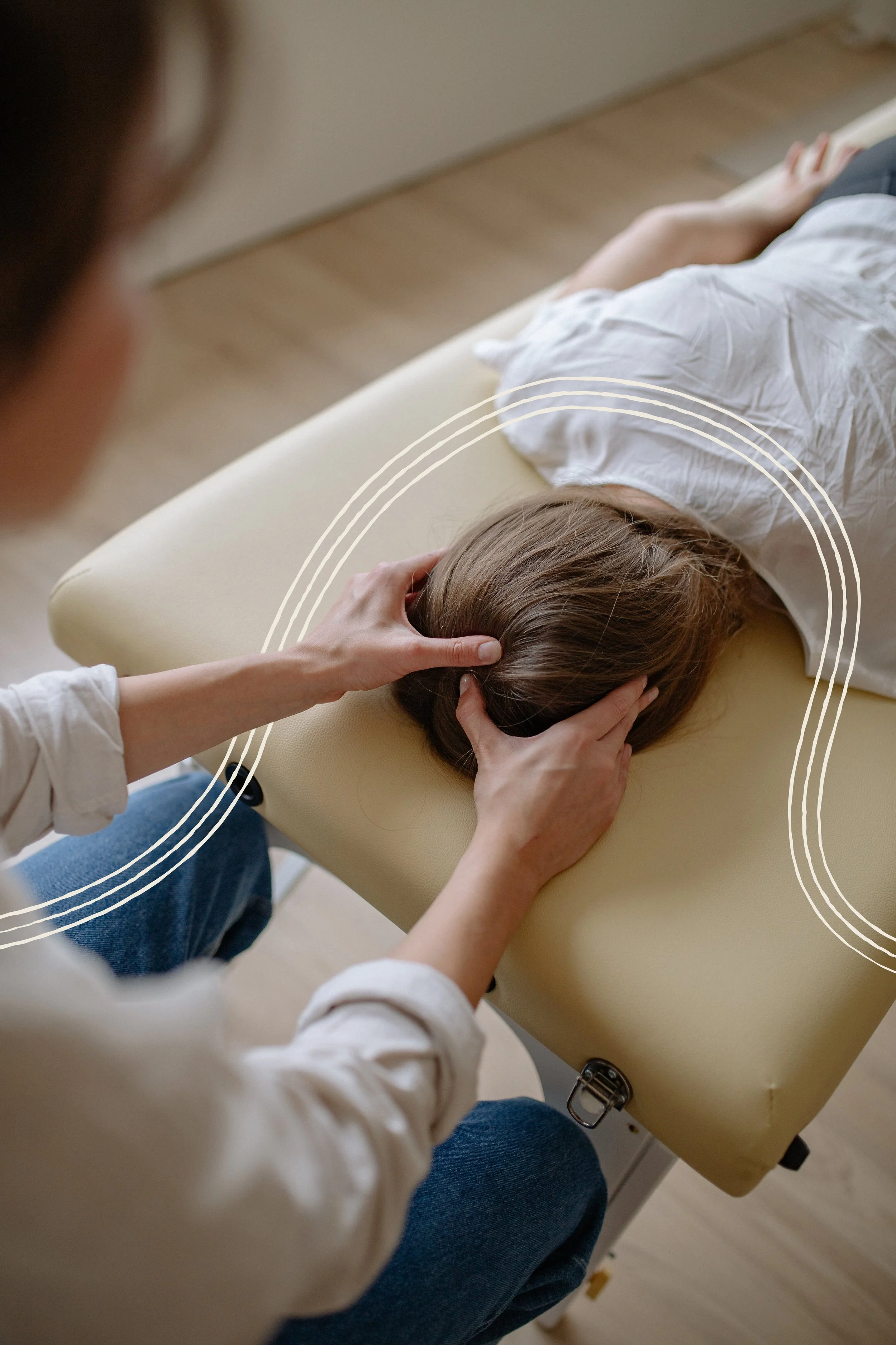 Person receiving a chiropractic adjustment or neck massage from a healthcare professional in a clinical setting.