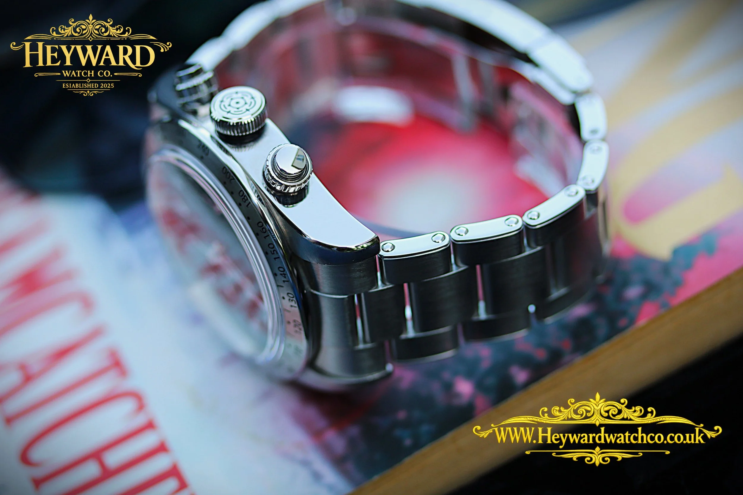 A closer look at the Tudor chronograph’s crown, pushers, and solid‑link bracelet, showcasing crisp machining and refined finishing.