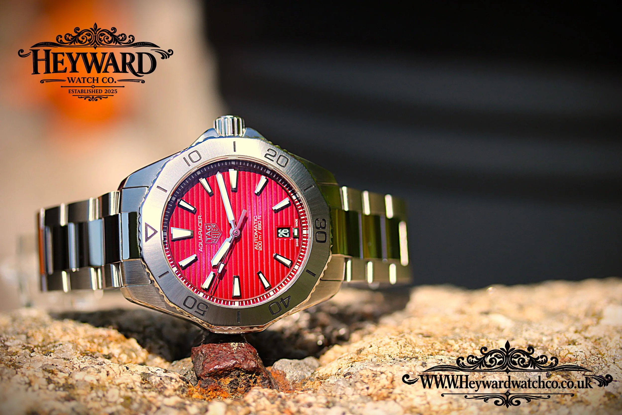 The Aquaracer’s Red dial catching natural light, built for everyday adventure.