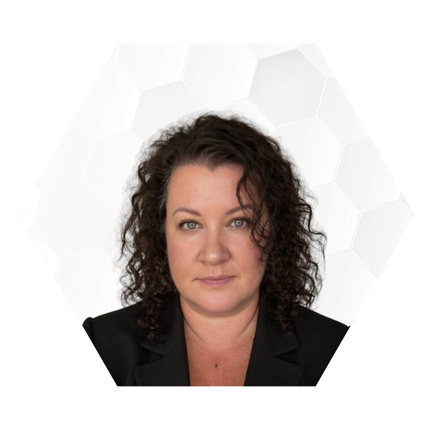 Headshot of a woman with curly dark hair, wearing a black blazer, against a white background with a subtle hexagonal pattern.